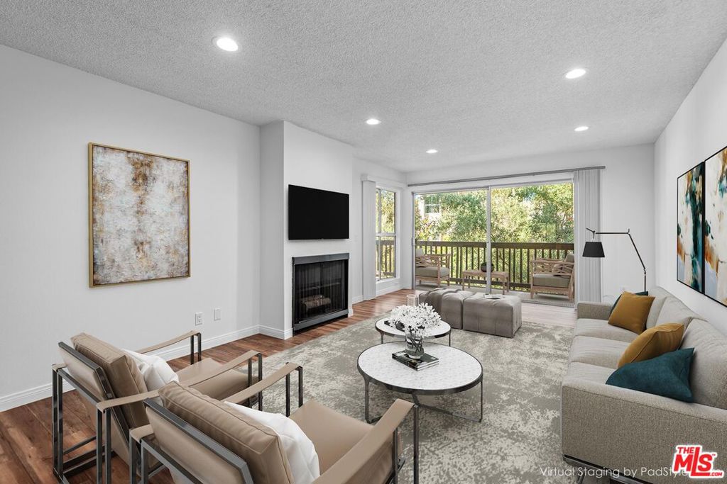 Welcome to Raintree - one of Culver City's most desirable gated communities. This spacious 2-bedroom, 2-bath condo features beautifully updated kitchen and bathrooms, Travertine tile flooring, brand-new carpet, and refreshed paint throughout. The inviting living room offers laminate wood-look floors, a cozy fireplace, and treetop views, all opening to a generous wraparound patio perfect for indoor-outdoor living. Stay comfortable year-round with central AC and heat and enjoy the ease of elevator access and a shared laundry room just steps away. Raintree is one of Culver City's premier condo complexes, set on lush, park-like grounds surrounding a tranquil lake complete with ducks and scenic walking paths. Amenities include multiple heated pools, a spa, a state-of-the-art fitness center with sauna, several recreational buildings, and 24-hour gated security with full-time guards. HOA dues include water, gas, and convenient laundry rooms on every floor.Located within the highly regarded Culver City School District, including sought-after Farragut Elementary, this home is just minutes from vibrant Downtown Culver City, with its fantastic restaurants and bars, as well as Sony, Amazon, and Apple Studios. With quick access to Santa Monica, Venice, Playa Vista, and the Ballona Creek Bike Path, Baldwin Hills Overlook, Playa Trail, and Kenneth Hahn Park, you'll enjoy the perfect balance of city convenience and proximity to nature.Pet-friendly and community-minded, Raintree is a wonderful place to call home.