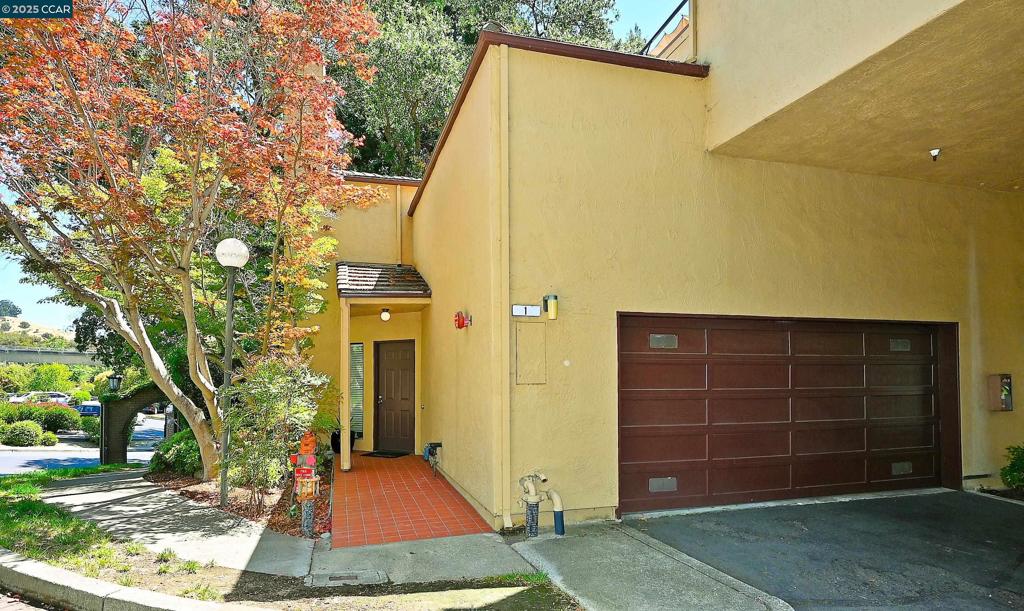 Beautifully updated end-unit offering style, function & privacy. With only one shared wall & no shared floors above or below, this level-in home lives like a single-family residence in a quiet, well-kept community. Light-filled open floor plan includes a living/dining area with wood-burning fireplace and glass atrium—perfect for office or dining with serene tree views. Kitchen features stainless appliances & gas cooktop. Upstairs, two en-suite bedrooms plus in-unit laundry. Fresh paint, new carpet, upgraded LED lighting, guest bath on main level, hard-surface flooring, outdoor balcony and attached 2-car garage with loft storage. Community pool steps away. Minutes to downtown Lafayette, BART, shops & freeways. Bonus: potential private yard under HOA review! Consider this home as a primary home, second home, or investment rental!