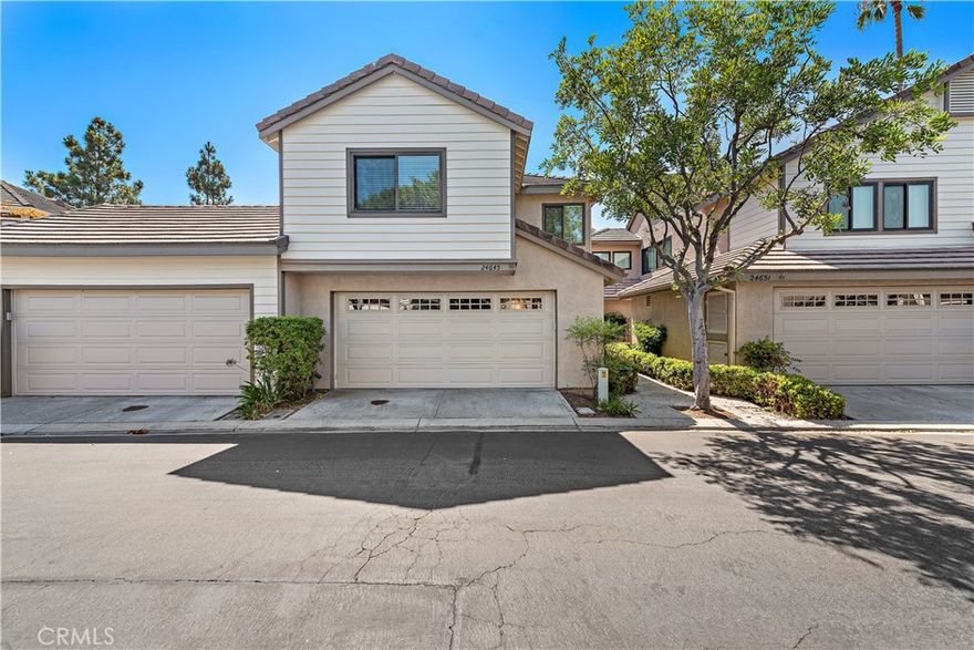 This spectacular Camden Court home features wood flooring throughout the entire downstairs and tile flooring in the upstairs bathrooms with elegant baseboards and recessed lighting throughout the home. Abandon Apartment Life and enjoy the privacy and comforts this attached single family residence offers. You'll enjoy the welcoming living room with vaulted ceilings and a fireplace. Graceful dining room with views of the private backyard. The kitchen has been remodeled and upgraded to include customized cabinets with decorative handles, quartz counters and backsplash, stainless appliances and recessed lighting. Generous storage space throughout the home. Laundry area is located inside the 2 car garage. Unique architectural design to enjoy the hillside views from upstairs and your backyard. Start the next chapter of your life in this charming Camden Court community featuring trails, parks, playground areas, tennis courts, gated pool and spa, and multiple areas for neighbors to gather and visit. Nearby canyons with hiking and biking trails, the Monarch Beach and Ritz Carlton Resorts, as well as the world-renowned Salt Creek Beach with its many surf breaks. Marina Hills shopping and restaurant establishments are numerous and just minutes away! Also nearby El Niguel Country club to practice your slice at the golf course, the Shops at Mission Viejo and the Kaleidoscope center. Experience the refreshing ocean breezes and the idyllic beach lifestyle in this perfect picture-perfect community. This home is spotless and ready for you to move in. Call today to see for yourself.