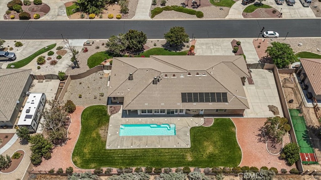 Don't miss this wonderful single-story executive home in the prestigious Royal Oak Estates featuring breathtaking panoramic mountain views. This beautiful, expansive home sits on 2.59 acres with the mountain backdrop in your back yard. Beautifully landscaped front and back with an in ground lap pool, and larger enclosed patio for spending your evenings. The interior offers a grand living room, office, family room
and large kitchen with breakfast nook and eating bar. The kitchen offers tons of cabinet and counter space and features granite countertops, a prep island and a large walk in pantry. The oversized laundry room offers plenty of storage throughout. This floor plan offers two primary suites, perfect for the multi-generational family, plus 4 1/2 bathrooms. The main bedroom offers a lovely stone fireplace. All bedrooms are all good size, most with views to the back yard. The property is completely fenced with RV access and a 4 car finished garage. This home is move-in ready and just waiting for you to make it your own. Conveniently located east of the 15 freeway.