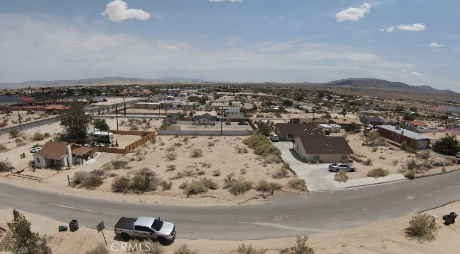 Prime Downtown 29 Palms Lot with Utilities – Affordable Desert Investment
This 0.18-acre parcel sits in the heart of downtown 29 Palms, offering water and power in the street and unmatched accessibility to all local amenities—shops, restaurants, schools, and the iconic entrance to Joshua Tree National Park just minutes away. Whether you’re ready to build now or simply hold as a long-term investment, this property is perfectly positioned in one of the fastest-growing desert markets. Opportunities like this are rare at such an affordable price point. An added bonus: the adjacent parcel is also available, allowing you to double your lot size and expand your vision. All lot lines shown in photos are approximate. Buyer to verify all utilities and property details during due diligence.