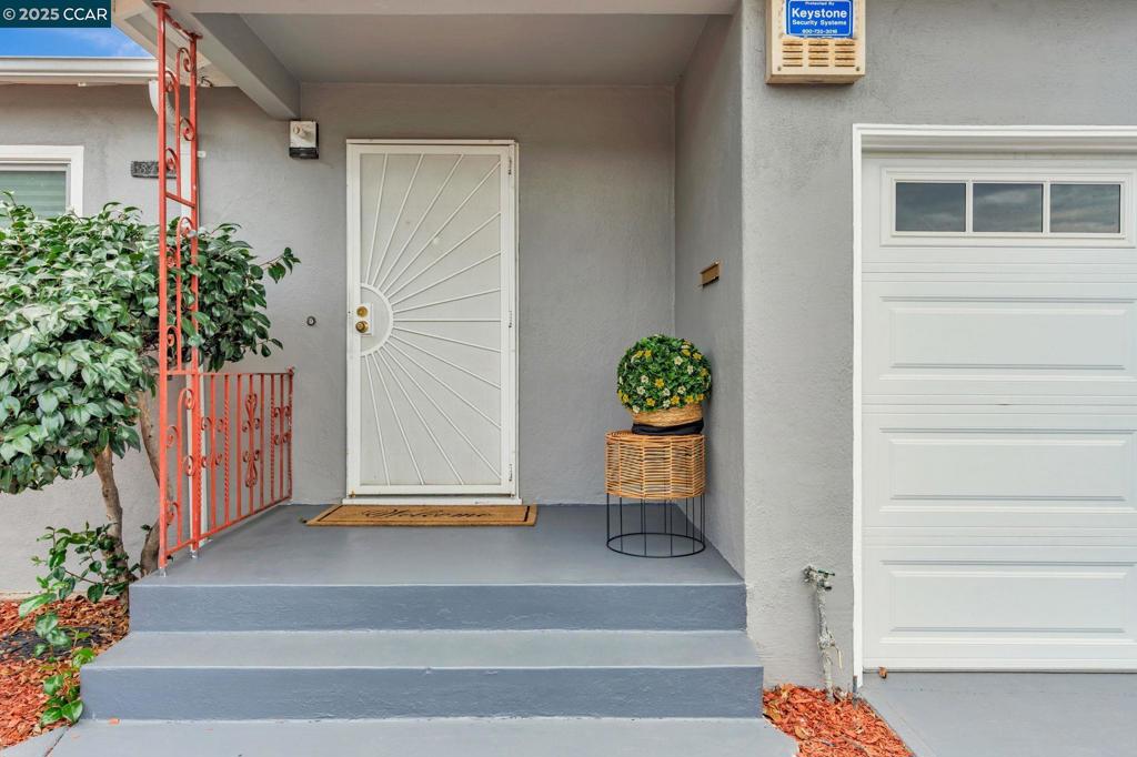 Welcome to this inviting 2-bedroom, 1-bath bungalow offering 995 sq. ft. of comfortable living space. Built in 1951, this single-level home combines vintage charm with modern updates, making it an excellent opportunity for first-time buyers, investors, or anyone seeking a cozy retreat. Step inside to discover a light-filled living area with warm, wood flooring that flows seamlessly throughout. The updated eat-in kitchen features stone countertops, a free-standing range/oven, dishwasher, and plenty of cabinet space, perfect for everyday meals or entertaining. The home sits on a level 4,400 sq. ft. lot with a fully fenced yard consisitng of a 7' school grade fence, and decrotive rod iron security gate, and front porch. Enjoy outdoor gatherings, gardening, or simply relaxing in your private backyard. Parking is convenient with an attached garage offering interior access plus additional off-street parking. This home offers the perfect balance of comfort, convenience, and value—don’t miss your chance to make it yours!