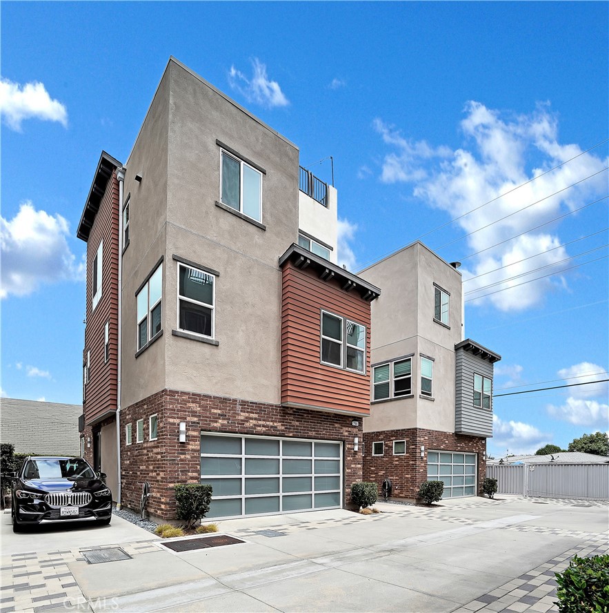 Welcome to this modern live/work loft. This IDEAL floor plan is a bright DETACHED home with designer upgrades throughout. Enjoy fresh air and views from ROOF TOP DECK. Zoned as Live/Work, the first level room is versatile as a home office, bedroom, guest room, artist studio, or flex living space, and offers a generous 1/2 bath. Second level offers 3 bedrooms, with 2 full baths, and 3rd level is your main living area with a designer open concept kitchen, a 1/2 bath and laundry closet equipped with a full-size washer and full-size dryer. Rooftop is too good to miss, and is your ultimate CA outdoor oasis with PANORAMIC VIEWS. On the main living floor, you will also enjoy an attached deck that is steps away from the roof top deck with built-in BBQ, sink and fridge! Mountain views from the living room add to your enjoyment. Gorgeous upgraded floors throughout the home including the staircases. Upgraded kitchen and bathrooms. Primary bath has beautiful stone work. Air conditioning and heat with 4 zones. Wired for alarm system, recessed lights, tankless water-heater and comes with built-in camera for front door. Surround sound hook-ups, built-in pest control. LOW HOA. Located towards the back of enclave with guest parking and common outdoor covered BBQ area. Quaint restaurants, coffee shops and all other urban amenities are nearby. Ocean breezes are refreshing, near employment and entertainment zones, perfect for work-at-home careers, as well.