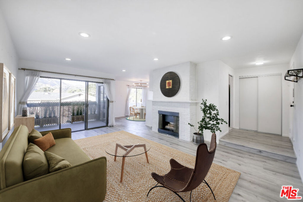 This updated contemporary condo sits on a tree-lined street just steps from the shops + restaurants on Brand Blvd. This oversized unit in a small-scale complex with only 1bedroom condos is filled with natural light + features an open floorplan with seamless flow. A formal entry leads directly to the kitchen with updated countertops + appliances or down to the spacious living room w/ gas fireplace. The dining room is perfect for entertaining friends + family with stunning treetop + mountain views. The oversized bedroom features 2 closets + access to the recently updated full bath. Sliding doors from the dining, living + bedroom open to a private balcony w/ mountain views perfect for enjoying your morning coffee or evening cocktails. The unit features luxurious updates including vinyl plank floors, recessed lighting + central hvac. The buildings many amenities include laundry, workout / recreation room + a sauna on every floor plus a sunny community pool & patio. This unit comes with an assigned parking space + storage in the gated subterranean garage.