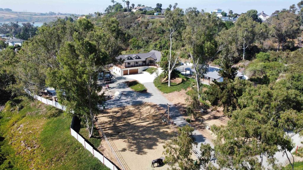Amazing 3.27 acre horse property located in the heart of Carlsbad for rent. Property features, 2 homes, a horse arena, 2 horse corrals, a massive metal barn, and a SKATEPARK. First house is a brand new SFR construction, built in 2024 and features a 5bed/4 &1/2 baths, quartz countertops, walk-in pantry, high end Cafe appliances. 3 of the bedrooms have their own bathrooms with quartz walls. The master bedroom has a beautiful porch and a large wak-in closet. The house has a massive oversized 3 car garage (1,300sqft), tons of storage space, and a private backyard with a hot tub and small 2-hole golf putting green. The second residence is a beautiful renovated farm house for featuring 3beds/2baths and an office/den, full kitchen, living room and dining area. Spacious master bedroom with full bathroom and double showers. High-end Cafe appliances, fully furnitured. Laundry is located inside the house. Private backyard with no neighbors in the back. Only a 5 minute walk to the Hedionda Lagoon and a 2 mile driving to the beach, local restaurants and stores. Link for application: https://apply.link/vP-A-lw