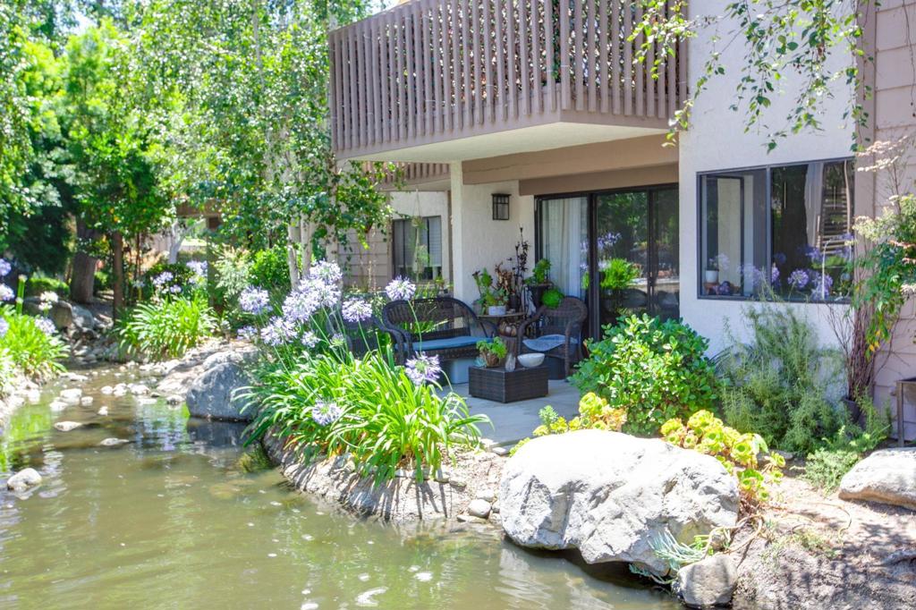 Nestled within Quail Creek, one of Laguna Hills' most enchanting hidden treasures, this peaceful, resort-style community offers an unparalleled living experience. Surrounded by a lush, park-like setting, you'll find beautifully elevated living with impeccable taste at every turn. Step inside this remodeled 1-bedroom, 1-bath first-floor condo and discover a blissful retreat with every modern comfort you could desire. Every detail of this sleek and modern marvel has been strategically designed for optimal space and functionality. From the moment you enter, you'll be wowed by the seamless blend of modern design, luxurious finishes, and functional upgrades that truly set this home apart. The heart of the home is the oversized chef’s kitchen, a culinary dream featuring tall glossy custom cabinetry, stunning quartz countertops with built-in outlets and USB ports, and elegant pendant and under-cabinet lighting. Enjoy convenient under-counter bar seating, two hidden spice racks, and an impressive corner cabinet system. Outfitted with high-end Samsung appliances, this kitchen is truly built to impress! Throughout the home, you'll appreciate the seamless flow of luxury vinyl flooring, all-new dimmable recessed lighting, and a completely updated electrical panel. Stay cool year-round with a newer A/C unit. Indulge in the spa-inspired bathroom, showcasing a custom rain shower with frameless glass doors, a heated towel rack, a floating vanity, and sleek fixtures. The custom closet system includes organizers and a built-in wall safe, while the convenient hidden Bosch washer/dryer is tucked neatly behind a stylish barn door with its own lighting. Whether you are looking for your first home, a fabulous retreat that you spoil yourself with or the perfect investment opportunity, immerse yourself in the exceptional, natural beauty of the Quail Creek community, where mature trees, gentle creeks, koi ponds & cascading waterfalls create a truly serene environment. Residents enjoy access to two sparkling pools (one heated), two saunas, two hot tubs, tennis courts, EV charging stations & scenic walking paths frequented by ducks & other local wildlife. Ideally situated at the intersection of Laguna Hills, Laguna Niguel & Aliso Viejo, and just under 15 minutes to John Wayne Airport, this condo offers the best of South Orange County living just minutes from world-class beaches, shopping, dining & entertainment. Whether you’re seeking a full-time residence or a weekend getaway, this home delivers the perfect balance of relaxation & convenience in one of Orange County’s most picturesque communities.