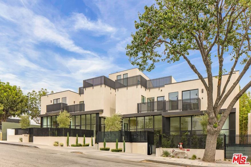 Grand Opening. Tucked along a tree-lined street just moments from Melrose Avenue and in the heart of West Hollywood, The Row on West Knoll embodies the perfect balance of refined architecture, sophisticated design, and effortless California living. Residence 922 unfolds across thoughtfully curated space, filled with natural light and dramatic double-height ceilings. Interiors are meticulously crafted under the direction of acclaimed designer Michael Berman, blending timeless elegance with modern sensibility. Rich engineered oak floors, striking quartzite countertops, and show stopping, chef-caliber kitchens equipped with Wolf and Sub-Zero appliances and custom Italian cabinetry by Pedini create a seamless flow of comfort and style. Three spacious en-suite bedrooms feature bespoke closets and spa-like baths. Private rooftop terraces and ground floor patios, expanding over 900 square, are an ideal location for entertaining or quiet relaxation. Dedicated cinema rooms, direct-access garages, and gated entry enhance privacy and convenience. Surrounding the residences, lush and tranquil landscaping by Mike Pyle Design integrates native plantings and modern hardscape to create a serene, cohesive environment that complements the architectural lines of the homes. Located just steps from Melrose Avenue, the Sunset Strip, and Santa Monica Boulevard (and the upcoming Erewhon West Hollywood), residents are minutes from some of the city's finest dining, shopping, and nightlife. The Row on West Knoll represents the pinnacle of contemporary West Hollywood living.
