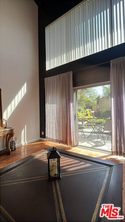 Less than 2 miles from South Coast Plaza is this beautiful End Unit with one common wall and no one below and no one upstairs. Spacious 780 square feet 1 bedroom 1 bath available for rent. Loft style layout, 2 story floorplan. Bedroom and bathroom are located upstairs, and feature ample closet space, a tub/shower combo, large vanity, and washer and dryer. The lower level features and open kitchen with an island for entertaining guests, an open living room space with high vaulted ceilings, and a sliding door leading you to your patio space. Flooring throughout. Appliances included are a gas stove/oven, microwave, dishwasher, washer/dryer unit, refrigerator with a built in ice maker. 1 enclosed carport parking space with storage, and the ability to add 1 additional open parking space. Gated community with amenities; a pool, spa, bbq grills, and a gym. The gym is charged annually. Close proximity to 405, 55, and 5 freeways. Down the street from South Coast Plaza. John Wayne Airport is just a short drive away of approximately 10 minutes. Most utilities covered by owner such as water, gas, trash, and sewer.