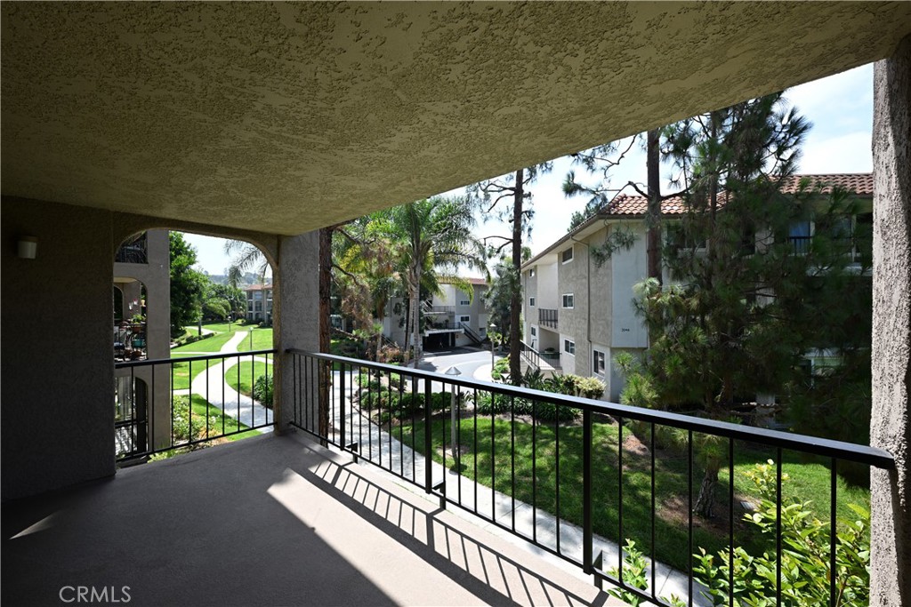 Villa Puerta Model - Big Views. Big Space. Single-Level Living. It’s not every day you find a spacious three-bedroom, two-bath end-unit condo in Laguna Woods with this much natural light and this much room to breathe. The highly desirable Villa Puerta floor plan delivers open, flowing spaces, a large living/dining area made for entertaining, and mountain-and-nature views you’ll never tire of right from your living room and covered balcony.
Pride of ownership shows throughout. Enjoy comfortable carpet in the living areas and bedrooms and a layout that makes everyday living easy. Step outside your door to the resort-style amenities of Laguna Woods Village one of America’s top 55+ communities. Play a round on the private golf course, take a dip in one of 5 pools, explore 8 clubhouses, stay active at the fitness center, or join any of 250+ clubs. Laguna Beach’s art galleries, restaurants, and shoreline are just minutes away. This is a rare space in a rare location and it’s ready for you.