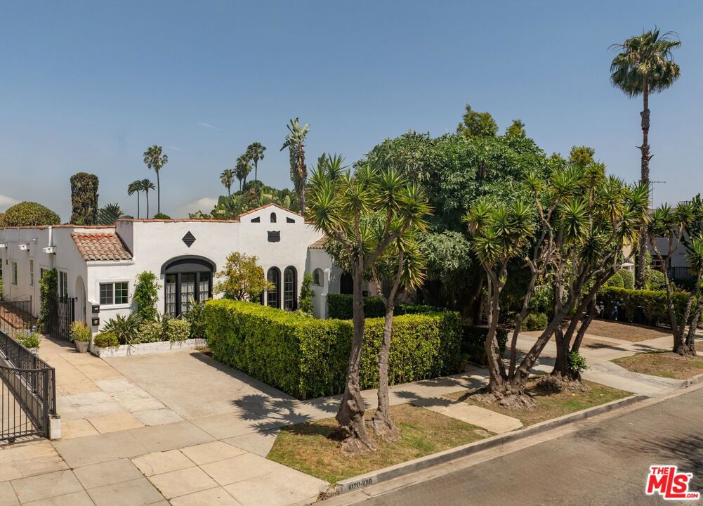 This meticulously maintained Spanish-style triplex radiates timeless charm and true pride of ownership in one of West Hollywood's most coveted neighborhoods. Privately set behind gates, the property is surrounded by lush, professionally designed landscaping and offers an inviting sense of serenity and privacy. A manicured front lawn leads to a palapa-covered outdoor dining pavilion perfect for al fresco entertaining while the elegant backyard fountain creates a tranquil retreat amidst the energy of the city. The front of the property features two spacious units, each offering two bedrooms and 2 bathrooms. Each unit includes spacious living and dining rooms a generously sized primary bedroom with desk or seating area opening up to the rear garden and a versatile second bedroom ideal for family, guests, a home office, or creative workspace. Interiors have been thoughtfully updated with designer finishes while maintaining the property's original architectural integrity. Highlights include custom built-ins, upgraded kitchens with premium materials, and optimized storage throughout.The rear unit is a charming 2-bedroom, one-bathroom residence with private in-unit laundry. It offers a quiet, standalone living experience ideal for tenants, guests, or supplemental income. The front units share a dedicated laundry area and enjoy the added convenience of off-street parkingan exceptional amenity in this prime West Hollywood location, offering new ownership time to plan for personal use or enhance rental potential.With authentic Spanish character, inviting outdoor spaces, and a high-demand location, this triplex is a rare opportunity to acquire a trophy property with built-in income and future upside.