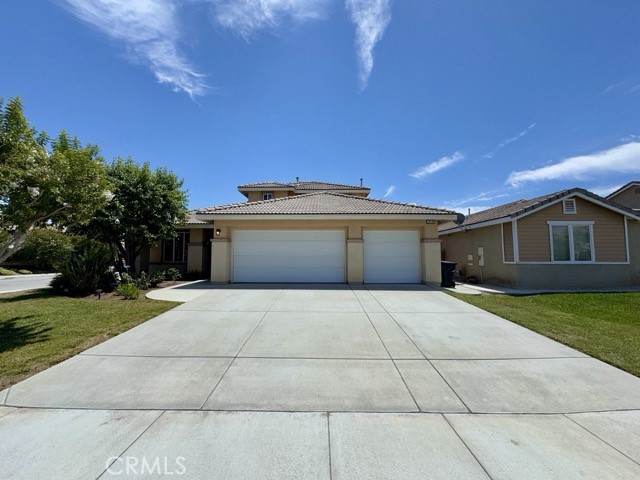 Welcome to this spacious 4 bedroom, two story home located on a corner lot in Menifee, complete with an attached 3 car garage! Inside, you'll find a well designed floorplan with the main living spaces, including three bedrooms, on the first floor, and a large loft with an additional bedroom upstairs. The kitchen is generously sized and features oak cabinets, tile countertops, stainless steel appliances, and an open layout that connects to the dining area and family room. The family room includes a cozy fireplace, perfect for relaxing evenings. Down the hall from the family room, you’ll find the laundry room, 2 full bathrooms, and three bedrooms including the oversized primary suite. The primary suite offers ample space for a seating or office area, two closets (including a walk-in), and an ensuite bathroom with dual sinks, a soaking tub, and a separate shower. Upstairs, the versatile and expansive loft is perfect for a second living area, office, or game room. The fourth bedroom features its own walk-in closet and a private full bathroom, offering privacy and comfort. The backyard provides plenty of space for year-round enjoyment and outdoor living. Schedule your showing today!