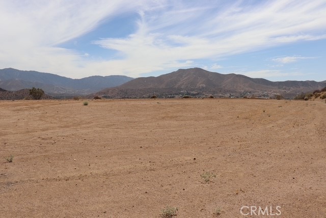 Easy access 5 acre view lot. Graded and very flat building pad. Lot offers a panoramic view of downtown Acton and Parker Mountain. Partially graded. Smooth dirt road access. Great opportunity to own a great piece of land with the potential to build your dream home. Zoned for animals. Zoning is A21 Possibility of county water supply. Buyer to verify. Come for a visit. Stay for a lifetime. Welcome Home!