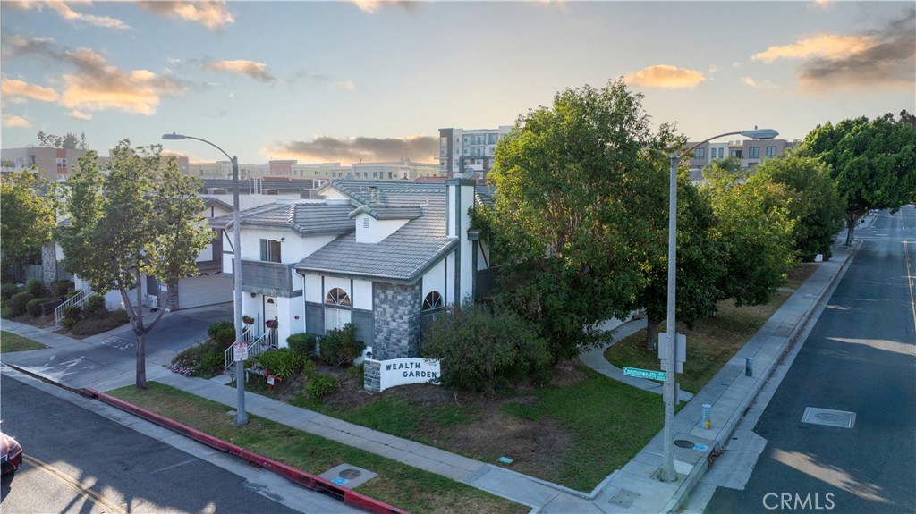 Nestled in the heart of Alhambra, this inviting two-story townhouse is located within the highly sought-after Wealth Garden Community. As a front unit, it offers the feel of a single-family home with 3 bedrooms and 2.5 bathrooms. The spacious living room features soaring vaulted ceilings, creating an open and airy atmosphere, while the adjacent dining area provides a natural flow for gatherings. Upstairs, the primary bedroom offers its own private bathroom, walk-in closet, and balcony access. Two additional bedrooms share a hallway bathroom. The attached two-car garage provides direct access and includes a dedicated laundry area. Residents enjoy a well-maintained community with a swimming pool, BBQ recreation area, and guest parking. The monthly HOA dues of $280 include fire insurance, water, trash, and exterior maintenance. Conveniently close to Alhambra Place Shopping Mall, 99 Ranch Market, the movie theatre, and the vibrant Alhambra downtown, with easy access to DTLA and Pasadena, this location offers an ideal balance of comfort and urban living.