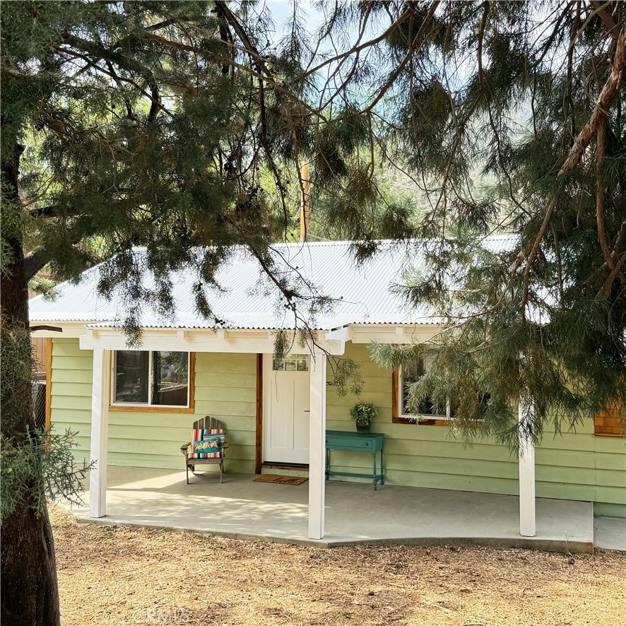 Imagine waking up to the scent of fresh pine, sunlight filtering through the trees, and cool mountain air all year long. This beautifully remodeled 3bedroom, 2bath home is the peaceful retreat you've been searching for. A blend between modern and rustic makes it the perfect match for this mountain community! A step-down master suite has been added with it's own private bathroom and walk-in shower, laundry room/mudroom and access to a backyard that is more than just private, it's inspired! Enclosed with creatively designed corrugated metal fencing, it's a blend of function and flair, ideal for relaxing evenings, entertaining under the stars, or simply enjoying your own quiet corner of the mountains. All appliances are brand new and come with a home warranty. Enjoy all four seasons in this rare gem!
Perfectly situated just 35 minutes from both Bakersfield and Santa Clarita, and only 20 minutes to the Tejon Outlets for shopping, dining, and entertainment. AND ... Coming Soon, only minutes away from the brand new Hard Rock Hotel & Casino promises even more excitement just a short drive away.
Whether you're looking for a full time residence or a weekend getaway, this mountain gem offers it all. Comfort, convenience, and the crisp clean air of nature.