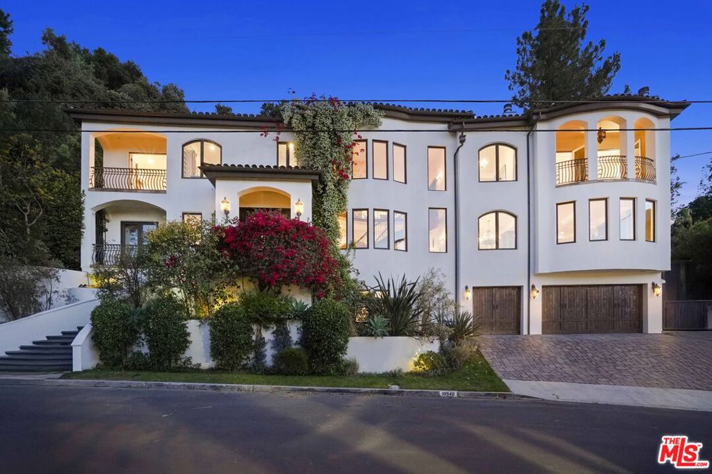 Presenting a grand, enchanting residence of notable distinction sited sky high in the hills of Studio City's acclaimed Wrightwood Estates. Crowning over a 1/3 acre lot on a peaceful, serene cul-de-sac, the home beautifully bridges the aesthetic divide between structure and nature surrounded by a vast, magnificent mountain backdrop. Boundless, breathtaking views of the mountains beyond and the city below are showcased from abundant vantage points, expansive picture frame windows and view decks throughout the property. Inspired by the famed Santa Barbara Spanish, this romantic architecture is timeless in its appeal. A unique symmetry of alluring old world elegance with the superlative style, high design and appealing amenities ideally suited for today's modern living. Light, open and quietly spectacular, the open flowing floor plan provides gracious transition from room to room. Baths are dressed in fine tile, fixtures and finishes. The kitchen is a bespoke open concept culinary dream center curated for the adventurous at home chef. Featuring a full array of state-of-the-art professional appliances. Opening to the family room it becomes the perfect gathering place for friends and family. With an emphasis on lifestyle, the outdoor space defines Southern California living at its finest as a continuum of glass atrium doors reveal a private backyard retreat and resort oasis fulfilling every entertainment possibility. Replete with outdoor BBQ, lawn, expansive pool and spa, waterfall and lounge and dining terraces. The quintessential venue for warm, relaxed poolside lounging by day, cool gatherings and lavish entertaining by night. Five en suite bedrooms including a magnificent, lux primary suite with view terrace and day spa inspired bath round out the comfortable accommodations for family and guests. Highlights include a direct entrance, three car garage and fabulous home theater perfect for gaming and movie parties. With proximity to CBS, NBC, Disney, Warner Bros. and Universal Studio and the chic shopping and dining district along Ventura Blvd. this stunning, distinctive property is a case study in quality craftsmanship where enduring style and high design are the legacy. This ultimate luxury urban hills retreat is the place and space where you want to live Welcome!