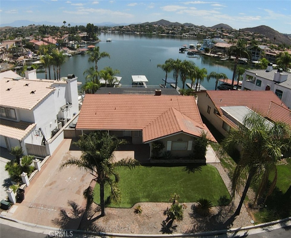 INVESTOR OPPORTUNITY and ALL OFFERS WILL BE ENTERTAINED. Incredible Lakefront Location! This is one of the most desirable lot locations in Canyon Lake with breathtaking views. Just a few paddles away from the main lake. Enjoy your private boat dock and lift to keep your boat out of the water all year round. This gated community is a great place for retirees or new families. The community features a private golf course, Olympic pool, numerous parks and sport courts right on the water. The foundation of this home has unlimited potential. Lots of room for entertaining in the back with little maintenance. The extra-large deck at the main level also features two sets of stairways leading down to the lower levels where you will find a large, covered area for entertaining. Another level down and you are in your boat, ready for some fun in the sun!