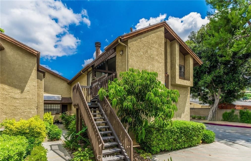 Welcome to your private retreat in the sought-after Lakeridge Whittier community! This beautifully upgraded end-unit condo offers the perfect blend of comfort, style, and convenience. Step inside and be greeted by soaring ceilings and stunning floor to ceiling windows that fill the home with an abundance of natural light. The open concept living area flows seamlessly to a spacious covered deck, ideal for morning coffee, weekend barbecues, or simply enjoying the serene surroundings. The thoughtfully newer kitchen features crisp white cabinetry, timeless granite countertops, stainless steel appliances, custom pullout shelving, and modern farmhouse-inspired lighting, perfect for cooking and entertaining. The master suite is equally inviting, complete with a large walk-in closet, skylight, and recently updated waterproof laminate flooring and baseboards, creating a relaxing sanctuary to unwind. Engergy efficient doublepane windows with loe-366 rated glass to block heat and UV rays, keeps the home properly insulated. Enjoy the ease of in unit laundry, a newer water heater, and a private three sided garage located directly below the unit for secure parking and additional storage. Lakeridge is a tranquil, gated community surrounded by lush landscaping and peaceful creeks, with resort style amenities including four swimming pools, relaxing spas, saunas, and tennis courts all maintained by the HOA. An additional parking space is also available through the HOA for $60 monthly fee. Perfectly located near shopping, dining, and easy freeway access, this home is move-in ready and waiting for you to make it your own. Don’t miss the chance to own your own slice of Whittier living!