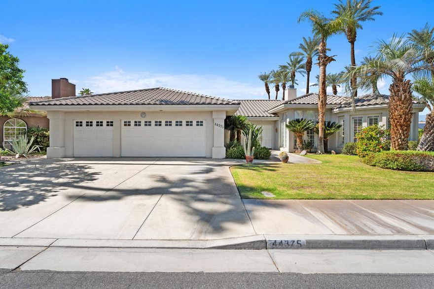 Welcome to The Grove, a highly sought-after community in the heart of Palm Desert. This beautifully maintained 4-bedroom, 3-bath home offers 2,716 sq. ft. of open, light-filled living space designed for both comfort and entertaining. Step through double entry doors into a grand foyer with high ceilings and 24x24 tile flooring throughout the main living areas. The spacious kitchen is a chef's delight, featuring stainless steel appliances, a gas cooktop, double ovens, a walk-in pantry, and a convenient breakfast bar that opens to the inviting family room with a wet bar and breakfast nook. The home also features a formal dining area with a cozy fireplace and a dedicated office, ideally situated between the kitchen and dining room. A spacious den with a Murphy bed adds flexibility for guests or hobbies. The primary suite is a private retreat, complete with a sitting area, custom walk-in closet with built-ins, and a spacious bathroom featuring dual vanities, tile shower, and a separate soaking tub. Throughout the home, you'll find plantation shutters, an individual laundry room with sink and abundant storage, and a three-car garage with newer openers. Additional upgrades include newer AC units, a new water heater, and the home is offered turnkey furnished, allowing you to move right in and start enjoying the desert lifestyle. Outdoors, the wraparound backyard provides a private oasis with a pebble-tech pool and spa, newer plumbing and pool equipment, a new pool heater, and an outdoor shower. The lush grassy area provides the perfect space for pets or entertaining, all framed with mountain views. Experience elegant desert living at its finest in The Grove--close to premier shopping and dining on El Paseo, golf, and everything Palm Desert has to offer.