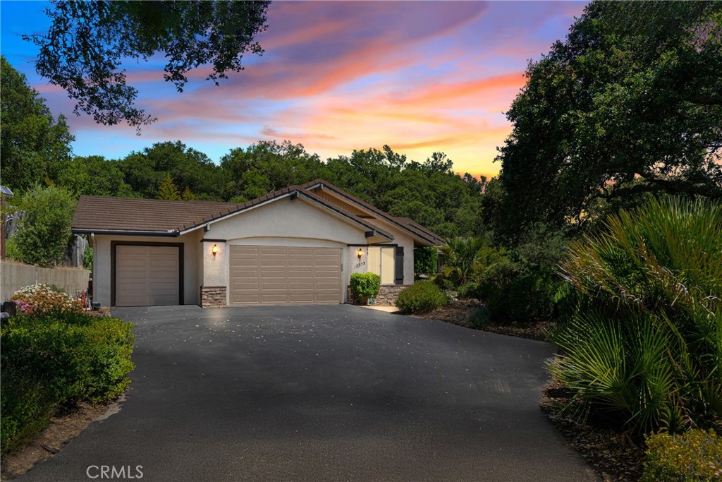 Welcome to 12703 Paso Verde, tucked away at the end of a quiet cul-de-sac in the coveted Oak Ridge Estates. This lightly lived in 4-bedroom, 3-bathroom residence spans approximately 3,498 square feet on a gated and meticulously landscaped 6.13-acre parcel.
Surrounded by stately oaks and basking in a peaceful microclimate, this spectacular estate offers unparalleled privacy, breathtaking views, and over $90,000 in recent upgrades.
Step inside through a grand formal entry and you are met with tall vaulted ceilings, hickory hardwood floors, architectural niches, and walls of windows that bathe the home in natural light. A formal living room and elegant dining space sit just off the entry, while the heart of the home lies in the expansive family room with a cozy fireplace, flowing effortlessly into the chef’s kitchen. This gourmet kitchen is appointed with granite countertops, a large center island with bar seating, stainless steel appliances, custom cabinetry, and ample prep space for hosting unforgettable meals and gatherings.
Adjacent to the kitchen is a casual dining nook, where French doors lead to an oversized back patio—ideal for BBQs, lounging under the stars, or soaking in the peaceful surroundings.
The primary suite is a private haven featuring tall ceilings, a spacious sitting retreat anchored by a marble-surround fireplace, large picture windows showcasing the property’s serene vistas, and direct access to the patio. The en suite bath includes dual vanities, a custom sitting area, a never used jetted soaking tub, a dual-head walk-in shower, and two walk-in closets—offering both tranquility and function.
Down the hall, you'll find three generously sized guest bedrooms with 10-foot ceilings and ample closet space, two full guest bathrooms, and a well-appointed laundry room with built-in storage.
This estate is loaded with thoughtful amenities, including: Owned solar system with Tesla battery backup, Upgraded rain gutters with LeafGuard, Wired for security, 220V power in the oversized three-car garage and laundry room, pre-plumbed for water softener, fruit-bearing peach, orange, lemon, grapefruit, and olive trees.
The gently sloped hillside and rich soil support a unique microclimate perfect for specialty crops and outdoor living alike.
All of this is just 12 miles from Morro Bay’s stunning coastline and only 20 minutes to Paso Robles wine country, where award-winning wineries, restaurants, and boutiques await.