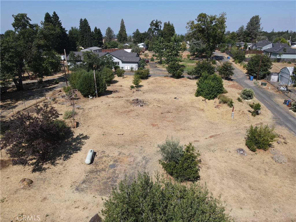 Wonderful Lower Paradise Location for this usable .73 acre lot. This part of Paradise definitely gives you a county feeling! Great location for gardening! SURVEY COMPLETE. WATER ACTIVE WITH BACKFLOW AND WORKING HOSE BIBS, PG&E ELECTRICITY METERED ON THE PROPERTY MOUNTED ON PG&E APPROVED PEDASTAL, 1500 GALLON HOLDING TANK, FENCED GARDEN AREA AND STORAGE SHED. So much of this property is ready for a new owner to submit house plans and get to building. The Septic system was installed in 1998, septic tank failed but leach field passed in 7/12/2019. Paradise permit shows a permitted 3 bedroom leach field. End of the private road location makes for a peaceful and private location. This property is also zoned AR-1, Agriculture Residential which can give an owner many different options as compared to Town Residential. This property is ready for a new Paradise resident.