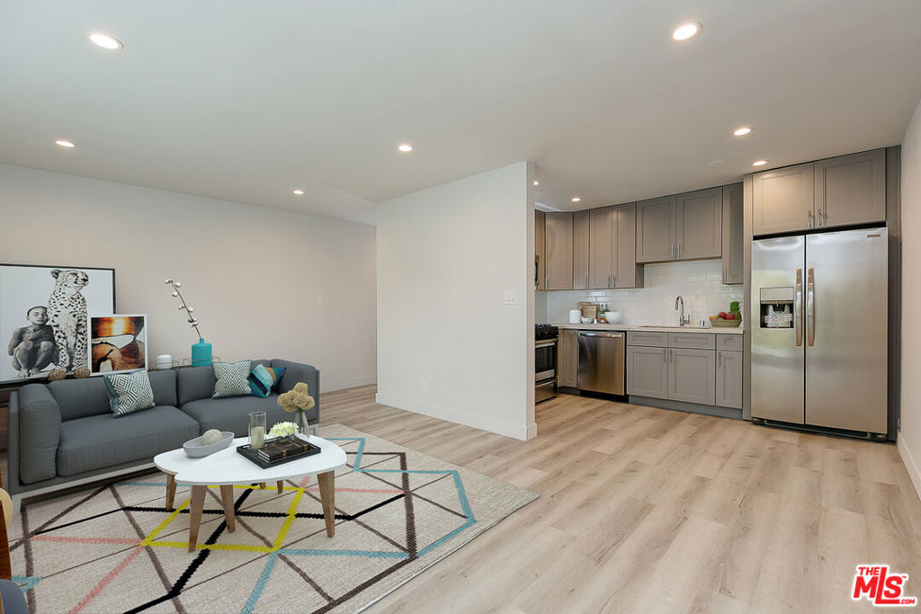 Luxurious 2 bed / 2 bath apartment located in HISTORIC ADAMS DISTRICT, blocks from West Adams and Mid City. Conveniently located a couple blocks from the 10 Fwy entrance. Everything has been redone with designer finishes!!! Brand New windows, new doors, new bathrooms, new flooring, new recessed lighting, new faucets and fixtures, STAINLESS STEEL APPLIANCES, and washer and dryer included INSIDE THE UNIT! All the work has been tastefully done. Pictures don't do it justice! Contact us now to schedule a showing. One parking space in the building and the other is on the street with permit. Plenty of parking on the street! Many parking spaces always available!!!