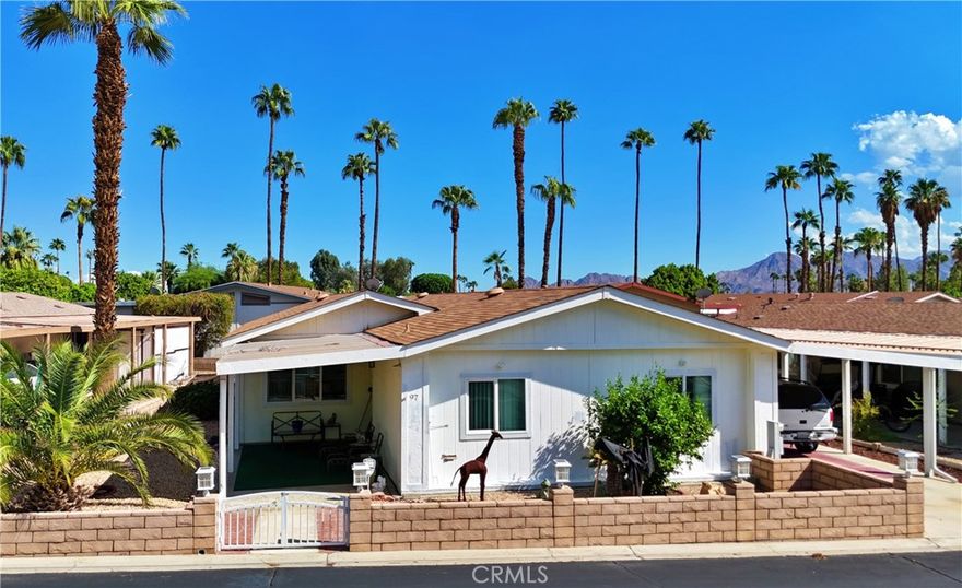 Experience Southern California living in this gated 55+ community of Suncrest Country Club. Palm Desert has a storied history and one that invites people from all over the world looking for warm winters, entertainment and endless social opportunities. This property is centrally located to prime shopping, restaurants and all Palm Desert has to offer. Community itself is well maintained with gate access, a pro shop, 9 hole golf course, pools, spas, cafe, pickleball courts, tennis courts, club house with billiard room, scheduled activities, and a sense of community that brings people together. A stone wall, wrought iron gate and planters welcome you into a courtyard rarely seen within the complex. A deep covered carport is a nice amenity to shade your vehicle and store all your treasures. An expansive living room with a vaulted ceiling and several windows creates a warm and inviting space. Large corner entertaining bar adds an additional gathering and seating. Split floor plan allows for privacy between each of the two large bedrooms. Dining area with built in hutch just off the kitchen provides extra storage and display of your favorite dishes. Master bedroom and bath is impressive with an extra large closet and corner soaking tub in bath. Property and community is ideal for seasonal stays or full time country club living.