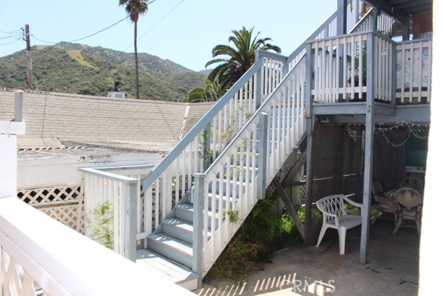 TRUST SALE, duplex between Metropole and Sunny Lane. Built in 1914. Upper unit named as "A" unit is a two bedroom, one bath with a small bonus room. One bath with stall shower, toilet and vanity. Kitchen with newer countertop, gas stove and double sink. Loads of windows and is light and bright. Patio off kitchen with ocean and hillside views.
Lower unit is a 1 bedroom with one bath. Kitchen, dining room & living area are light and bright. This unit also has outdoor space, patio and yard area.
Fee simple land.
There is a bonus unit below (pictured) which is not permitted-JUST A BONUS