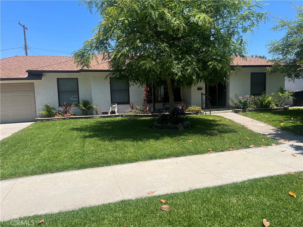 Welcome to 408 S. Indiana St., Anaheim in this cozy historic colony District. This beautiful 1581 SQ. Ft. house has 3-bedroom, 2 Bath. The large living room features Vinal Wood flooring with a gas fireplace at the far end and adjoins the formal dining room also final wood flooring. The kitchen was newly remodeled from floor to ceiling with quartz counter tops, new dish washer, new stove, new microwave and new cabinets with crown molding and recessed lighting. All electrical and plumbing have been upgraded. Both baths were recently remodeled. The lot size is over 8200 Sq. Ft.(per county assessor). One of the largest lots in the Colony. Plenty of room for an ADU! alley access to the rear of the lot for garages could make the ADU fully functional. In the center of the backyard is an enclosed gazebo with a Cal Spa that seats 6-8 people. Wonderful place to watch the Disney fireworks at night.or sports on the flat screen. Behind the gazebo is a mature avocado tree, Solar and central air/heat were added 2 years ago when the new roof was installed. This property has a 2 car garage attached.