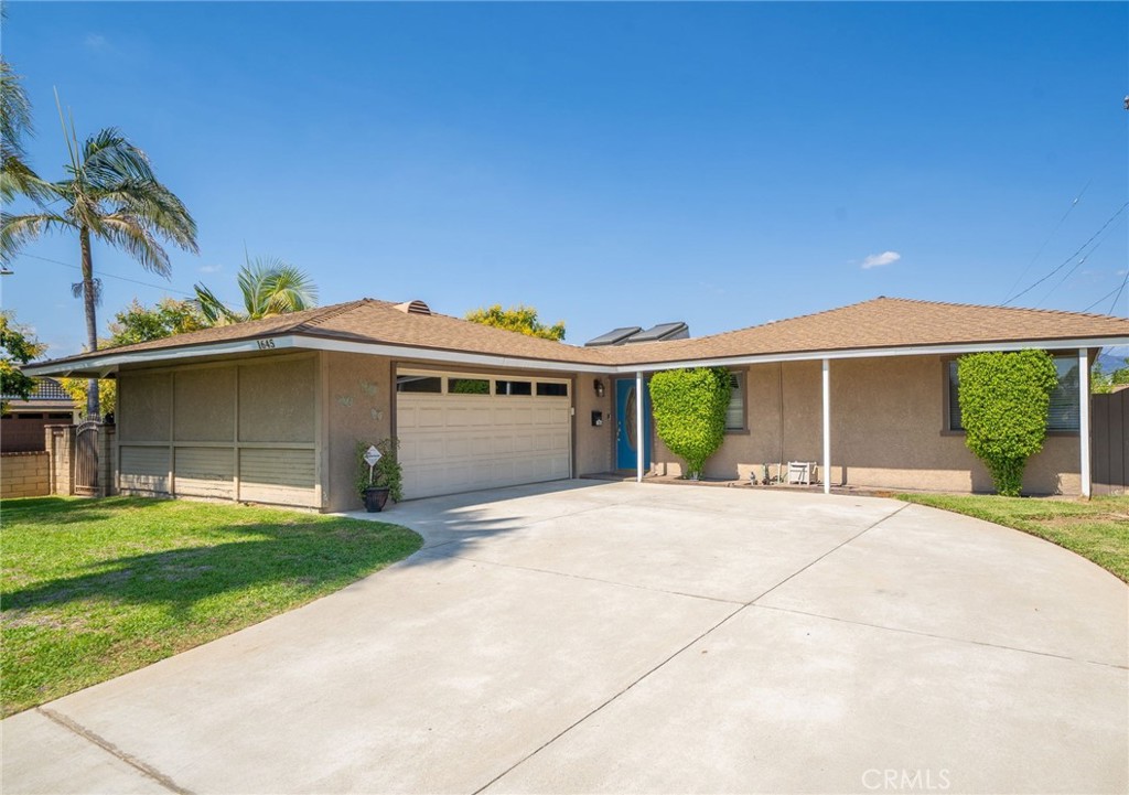 Welcome to 1645 Cypress Street, an upgraded 3 bedroom, 2 bathroom home nestled in a San Dimas neighborhood within the desirable Charter Oak School District. Situated on a generous 7,658 sq ft corner lot, this charming property offers 1,452 sq ft of thoughtfully designed living space and is perfect for both indoor comfort and outdoor entertaining. Step inside to a bright and open living room with a cozy fireplace, flowing seamlessly into an updated kitchen featuring stainless steel appliances (including a gas range, dishwasher, and refrigerator), ample cabinetry, and a spacious dining area. A separate formal dining room with sliding glass doors opens directly to the covered backyard patio. The primary suite includes a walk-in closet, private access to the backyard, and an en-suite bathroom with a walk-in shower. Two additional well-sized bedrooms share a full hallway bath with a combined shower and bathtub. Upgrades include: copper plumbing, dual pane windows, recessed lighting, and laminate and tile floors, Additional storage is available in the large hallway linen closet. Enjoy the California lifestyle in the private backyard oasis, complete with a built-in BBQ with granite countertop and bar seating, a large lawn area, and a spacious covered patio—ideal for entertaining family and friends year-round. Additional features include a two-car-attached garage with direct home access and in-garage laundry hookups, plus ample driveway parking. Conveniently located near freeways, shopping, and dining, this move-in-ready home offers comfort, space, and convenience in a family-friendly neighborhood.