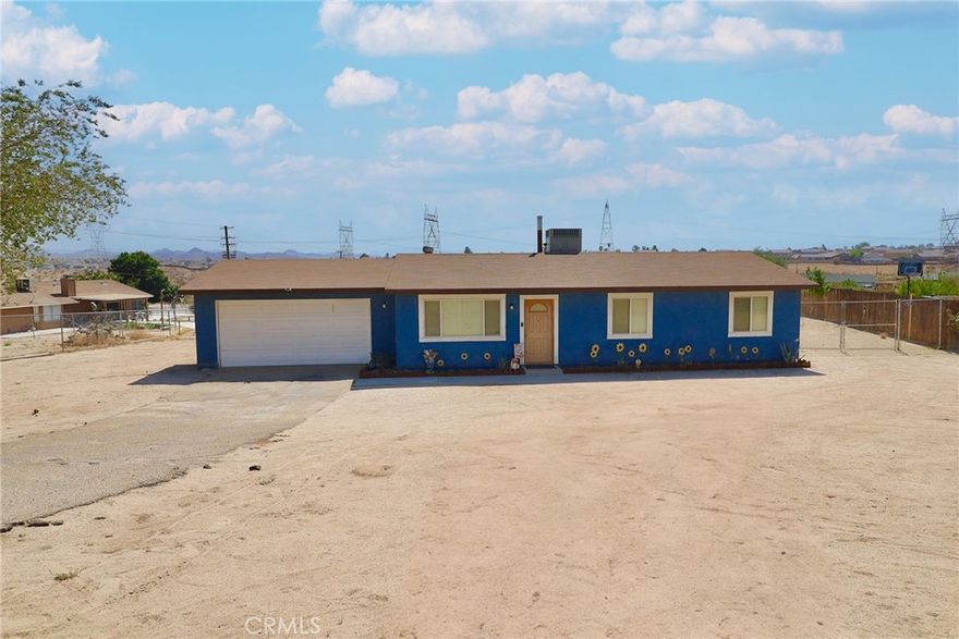 Price Just lowered for this Very nice and clean Single Family residence with a lot of potential. Offering a 3 bedrooms and 2 baths, living room and dinning area.  Almost 1/2 acre of lot, big eneough to build pool, adu etc. RV space with enough parking Area.