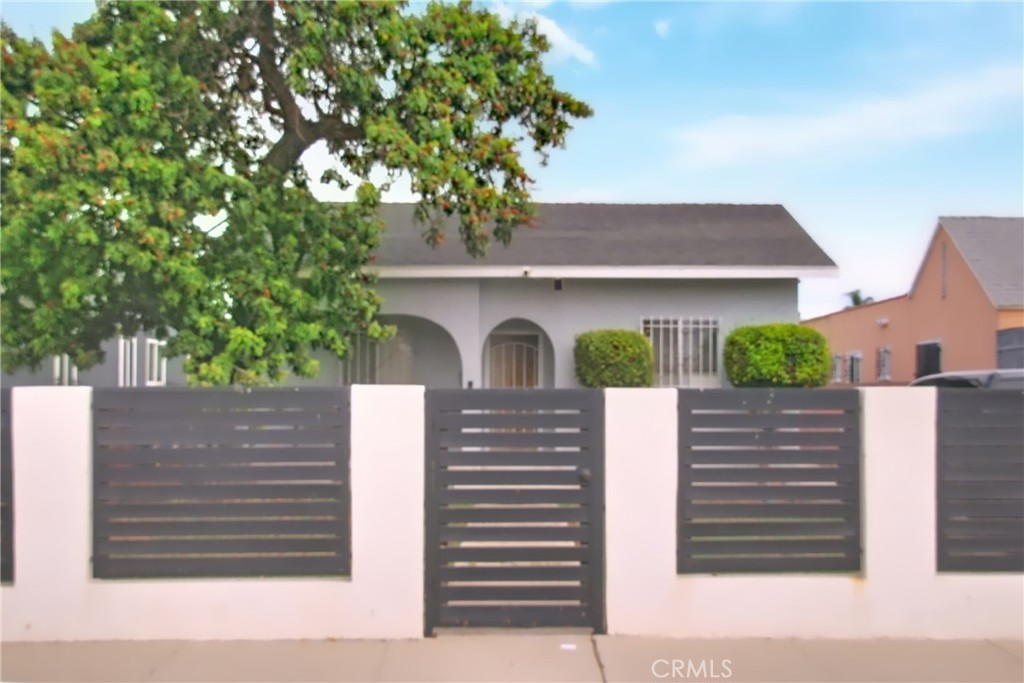 Welcome to 525 W 107th Street, a beautifully renovated California bungalow that perfectly blends timeless 1920s character with modern upgrades. Built in 1923, this inviting 2-bedroom, 1-bath home offers approximately 776 sq. ft. of thoughtfully designed living space on a generous 4,864 sq. ft. lot. Inside, you’ll immediately appreciate the fresh remodel featuring a gourmet-inspired kitchen with stainless steel appliances, sleek finishes, and an open, functional layout. The tastefully updated bathroom and abundant natural light enhance the home’s warm and welcoming atmosphere, making it truly move-in ready. Step outside and discover the fully fenced and gated lot, offering both privacy and huge potential for outdoor living, gardening, or future enhancements. This prime location places you just minutes from world-class sports and entertainment at SoFi Stadium, the Kia Forum, and the highly anticipated Intuit Dome. Cultural destinations at Exposition Park and nearby green escapes like Jesse Owens Park and Augustus F. Hawkins Park are within easy reach. Local dining favorites such as Lonell’s Soul Food, The Breakfast Shack, and El Majahual Pupuseria 2 add neighborhood flavor, while shopping at Hollywood Park Marketplace and Slauson Super Mall provides everyday convenience. With quick access to the 110 and 105 freeways, commuting throughout Los Angeles couldn’t be easier. With its ideal location, updated features, and undeniable charm, this bungalow is a fantastic opportunity for first-time buyers or anyone looking to put down roots in a vibrant Los Angeles community. Don’t miss the chance to make this remodeled home your own.