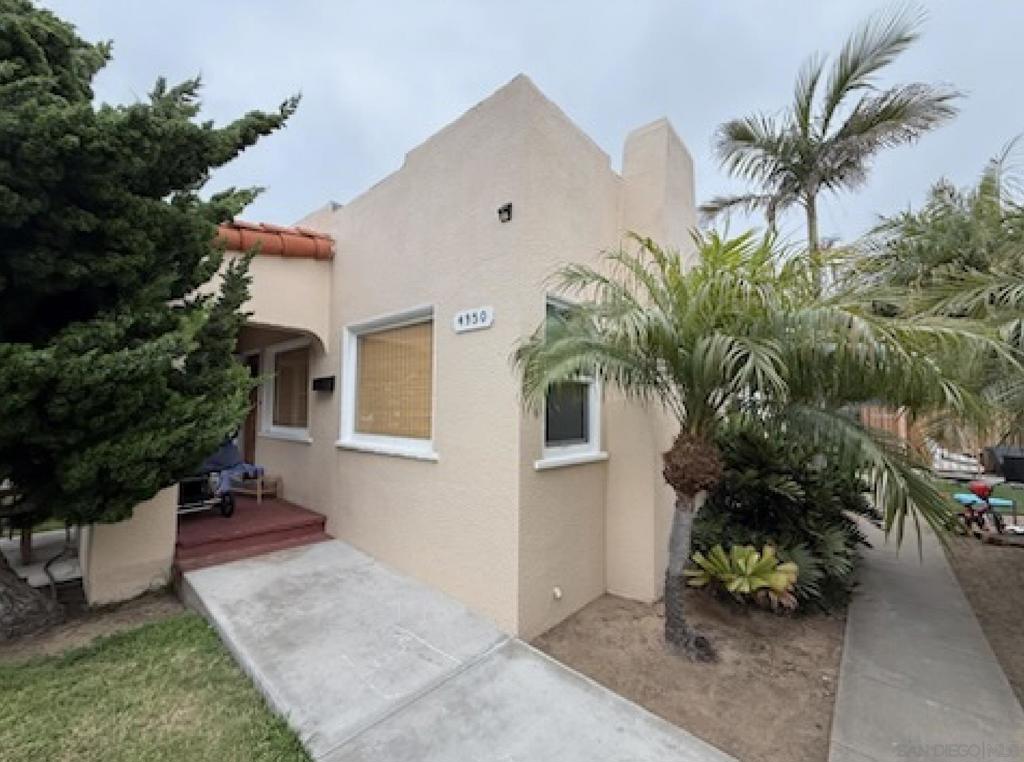 Ocean Beach Tropical Landscaped Classic! Freshly renovated in January, 2024, this charming detached home is situated just 1.5 blocks to the beach, walkable to dining, entertainment and all the beach life has to offer! Featuring, hardwood floors, fireplace, beautifully renovated kitchen w stainless appliances, renovated baths, 1 car garage + 1 additional tandem parking space and fresh paint throughout.