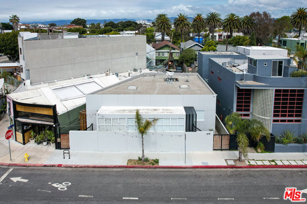 With low down payment SBA financing available & extra income from a mural wall scape, could owning a live/work property in Venice Beach help your creative business grow this year? What if you could own this amazing space for 15% less than it appraised for in October 2020? This is the opportunity at hand as the Seller needs to offset other gains in her portfolio, so we can structure a massive win-win with the Seller's loss and your gain! Etched into the heart of quintessential L.A. coolness in vibrant Venice Beach, and just brimming with potential to bloom into yet untold creative expression. Offering immense flexibility with allowable commercial and residential uses, and strategically located at the entry of the Windward Circle near the Venice sign, this unique creative office or live/work opportunity on a versatile C2 street-to-alley lot is a perfectly blended segue between commercial and residential corridors. Just a hop-skip away from Abbott Kinney (literally crowned "the coolest block in America" in GQ's Style Bible), and just a stone's throw to Rose Corridor and Main Street, just blocks to the sand, and billed as both a Walker's and Biker's Paradise, positively everything is within reach. The property itself presents as a standalone single-story boutique building with soaring skylit ceilings and bathed in abundant natural lighting, evoking the embodiment of SoCal vibes throughout its modern open floor plan. With a compelling blend of aesthetics and functionality, the building spans 1,634 square feet across three spacious bedrooms, recently remodeled kitchen and two bathrooms. Adding to the versatility, a storage room with separate entry and huge crawlspace are already in place for those in need of ample storage or data rooms, and the convenient alley access parking allows for 4 cars or room for additional upside down the road. Adjacent to a swathe of luxury residential homes and immersed in one of the highest concentrations of tech and creative residents of Silicon Beach, this property has provided consistent short-term rental income from a variety of clientele seeking inspiration from the buzzing cultural mecca that is Venice. And with 60 feet of prominent street frontage on Windward and accessibility to numerous amenities and restaurants provides for excellent visibility and lucrative signage opportunities for additional income potential. Presently permitted as a residential home, residential or SBA commercial financing may be available depending on intended use, presenting a unique opportunity to add a trophy location for creative business owners, investors, and homeowners alike. Less than a mile from Marina del Rey, just two miles from Santa Monica, easy access to the rest of the Westside Los Angeles via nearby Highway 1, 10 and 405 freeways, and access the rest of the world via nearby LAX Airport, all roads lead to Venice.