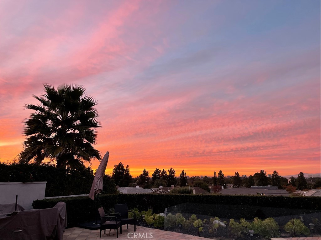 6 MONTH RENT BACK NO LONGER NEEDED! Replacement home identified!!! Welcome to an extraordinary custom single level modern masterpiece, perched in the coveted hills of Turtle Rock. This one-of-a-kind residence boasts gorgeous sunsets and unobstructed panoramic views, capturing the beauty of rolling hills and city lights, and even Disneyland fireworks. Radiating contemporary elegance, no detail has been overlooked in its impeccable craftsmanship designed for effortless easy-care and seamless indoor/outdoor living.This exceptionally private architectural gem was custom built in 2017, with nearly $800,000 invested at the time to elevate it to an unparalleled level of modern refinement. The moment you step inside, an awe-inspiring sense of openness greets you, as dramatic 16’ wide by 8’ high La Cantina doors dissolve the boundary between indoors and out. Additional strategically placed windows frame the stunning vistas, bathing the interiors in an abundance of natural light. At the heart of this home is an expansive great room, where soaring ceilings create an airy and inviting atmosphere. A luxurious family lounge features a sleek 75” Samsung TV, a striking contemporary fireplace, and a built-in entertaining bar complete with a wine refrigerator. The adjacent dining area is defined by a dazzling statement chandelier, setting the stage for unforgettable dinner parties against the backdrop of mesmerizing twilight views. The designer kitchen offers a stunning 14-foot-long waterfall-edge island is complemented by high-gloss white cabinetry and top-of-the-line KitchenAid appliances and sleek clean lines make this kitchen as beautiful as it is practical.The primary suite includes a private office/sitting area. The ensuite spa-inspired bathroom features floating vanities, designer lighting, and extensive use of Carrara marble-inspired finishes.A secondary en-suite bedroom continues the theme of refined modernity, with its own impeccable design and high-end finishes. Even the guest bath exudes elegance and a commitment to luxury. Revel in the resort-inspired backyard, where the expansive patio invite relaxation and entertainment alike and a sparkling pool and spa provide a serene oasis. Enjoy the seamless fusion of contemporary luxury with the great outdoors, state-of-the-art technology and awe-inspiring views. Award winning Turtle Rock Elementary & University High School are steps away. Exceptional nearby community facilities.