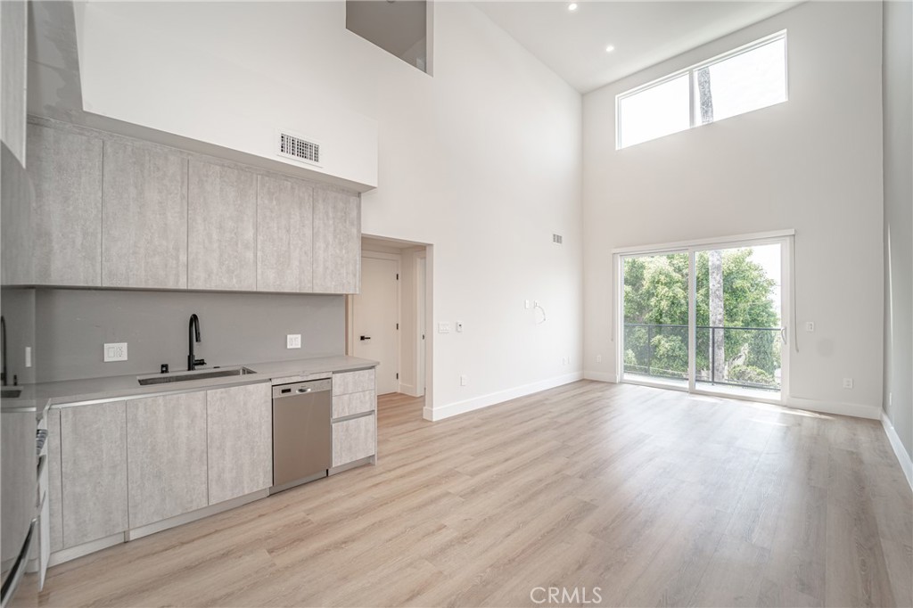 Welcome to a stunning two-story luxury apartment in Silver Lake, where sophistication and natural light converge to create a truly exceptional living space. This bright and spacious unit is designed to elevate your lifestyle, with large windows throughout and the balcony that invite an abundance of sunlight and provide picturesque views of the surrounding area. Step inside and discover a world of luxury and comfort. Each of the two bedrooms in this apartment is thoughtfully designed with a custom-made built-in wardrobe, offering ample storage space for your clothing and personal belongings. Storage space is an essential component of comfortable living, and this luxury apartment understands that. Additionally, this luxury apartment includes the convenience of its own washer and dryer. In addition to the remarkable features within the unit, this luxury residence also provides access to an exquisite rooftop deck boasting breathtaking 360-degree views of Los Angeles. With security cameras strategically placed throughout the premises, your safety and well-being are our top priorities.This luxury unit in the heart of Silver Lake represents the pinnacle of sophistication, combining stylish design, modern conveniences, and a prime location. Experience the epitome of luxury living in Silver Lake with this exceptional two-bedroom, two-bathroom apartment.