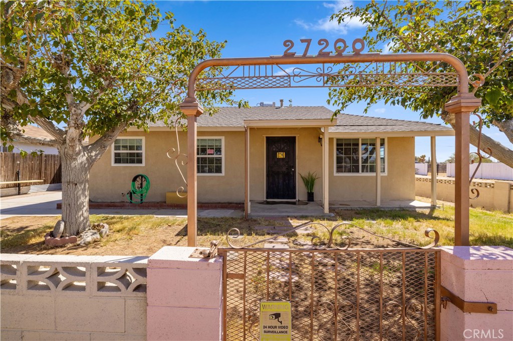 Move-in ready single story on a HUGE lot! ? This beautifully updated 3-bedroom home sits on a massive 10,000+ sq ft lot and is loaded with upgrades. Step inside to brand new flooring, fresh interior paint, and a stylish kitchen featuring a porcelain backsplash, stainless steel hood, new cabinetry, sink, and faucet. The living room pops with custom built-ins and a bold wood front door that makes a statement. Bedrooms come equipped with ceiling fans and upgraded closet doors, while the remodeled bathroom offers sleek, modern finishes with ceramic tile in shower. The enclosed patio with ceiling fan is perfect for relaxing or entertaining, and the oversized backyard includes double gate access and tons of space—ideal for a workshop, storage, or animal quarters. The fully fenced front yard features custom wrought iron gates for added privacy and curb appeal. Other upgrades include a new dishwasher, new electric garage door opener, and a tankless water heater. Home also boasts newer windows, security doors, and a 200-amp electrical panel installed 5 years ago. Walls were fully insulated and a new electric heat pump (A/C + heater combo) was added—also just 5 years ago. This one checks all the boxes—space, style, and upgrades throughout! “Some images have been virtually staged to better showcase the true potential of rooms and spaces in the home.”