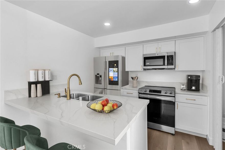 Turnkey & Move In Ready, Upgrades at this price = rare opportunity. Don’t wait! Ground-level (no stairs) 2BR/1BA condo with new laminate flooring, dual pane vinyl windows, remodeled kitchen featuring quartz countertops with modern gold finishes, recessed lighting throughout, and NO popcorn ceilings creating a bright and inviting living space throughout. The HOA covers water, trash, hot water and water heater maintenance — keeping monthly costs low. Excellent for first-time buyers and savvy investors looking for a rent-ready property. Don't miss this opportunity to own a beautiful, low-maintenance home that offers comfort, style, and value. Seller will cooperate with down payment assistance programs, and may consider some help with closing costs.