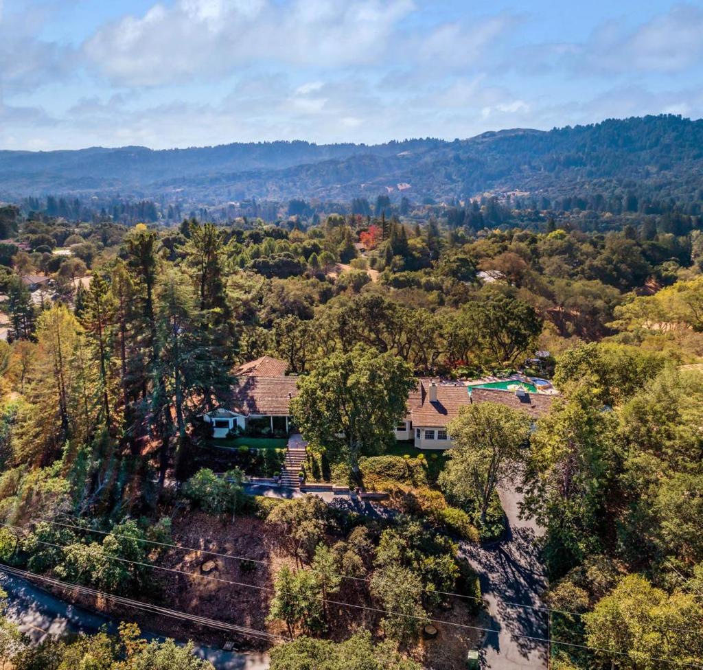 Located in the prime Westridge area of Portola Valley, this property with pool, spa and stand-alone office/studio offers spacious living spaces, striking views and an abundance of storage space. The homes single-level floor plan provides a variety of areas for both formal and casual entertaining as well as everyday living. The spacious living room offers views of the landscaped garden and western hills. Adjacent is one of two expansive family rooms as well as a formal dining room. The second family room is located just off the large eat-in kitchen. The garden, pool and spa are just steps away as well as a conveniently located full bath and laundry area. The original barn has been charmingly converted into a two-story office/studio and is situated on the lower portion of the expansive property. See disclosure pkg link for in-person visit rules.