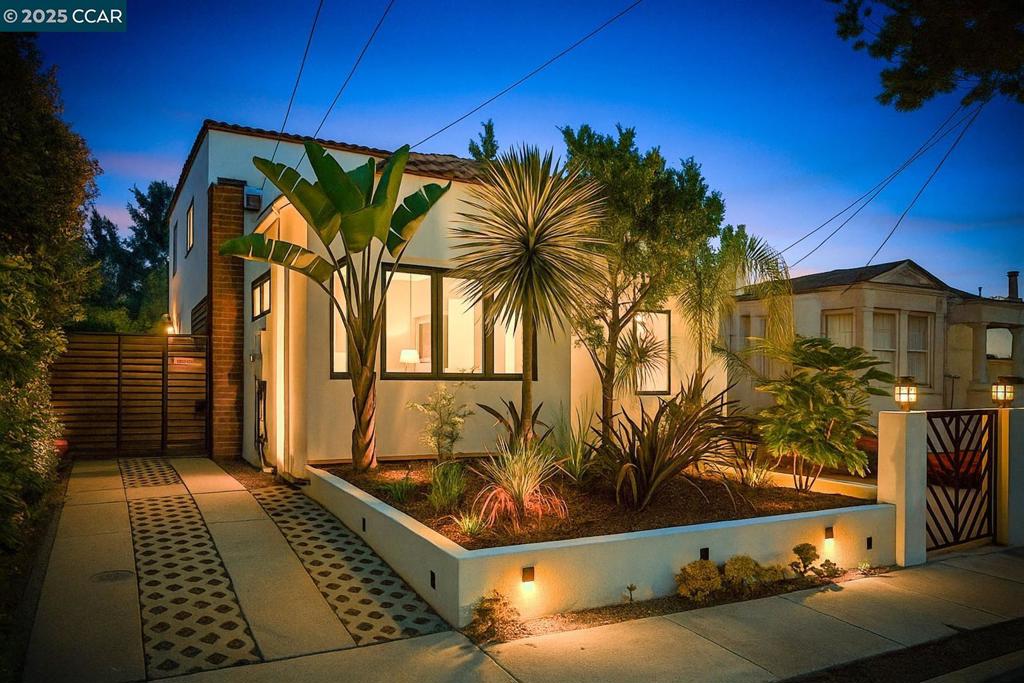 Stunning Hacienda Gem w/Permitted ADU & Modern Luxury in the Heart of NOBE! Fully remodeled in 2019, this beautifully reimagined Hacienda-style home in prime North Oakland blends timeless charm with high-end modern finishes. The spacious 1,952 sq ft main house offers 3 bedrooms, 2 baths, plus a bonus room perfect for an office, nursery, or gym. The private primary suite features a spa-like bath with radiant heated floors, floating double vanity, a large walk-in closet, & a serene balcony retreat.The designer kitchen stuns with solid walnut cabinetry, Bianco quartz counters, handmade tile backsplash, bar seating, & Mieli + Fisher & Paykel appliances. French doors open to a large deck-perfect for entertaining-overlooking a beautifully landscaped & private backyard oasis. At the rear, a fully permitted 541 sq ft ADU includes its own full kitchen, living room, private bedroom, stylish bath, laundry, radiant heated floors, and separate entrance—ideal for guests, extended family, or rental income. All-new energy-efficient systems, Tesla EV charger, & thoughtful designer details throughout. Located in vibrant NOBE near Rockridge, Temescal, BART, dining, coffee shops, & shopping. A rare opportunity to own two homes on one lot in one of the East Bay’s most desirable neighborhoods.