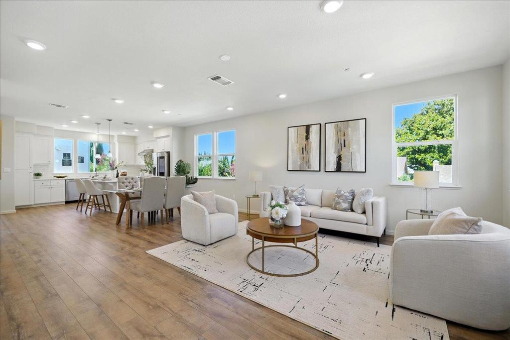 This stunning end-unit home is filled with abundant natural light and brimming with contemporary upgrades in the desirable Onyx community. One of the largest floor plans, this 4B/3.5B and two balconies layout offers exceptional space and comfort. The main level features an airy open floor plan with a formal dining space, a sun-filled living room, and a versatile bonus area. The gourmet kitchen showcases a large island, SS appliances, gas cooktop, and custom cabinetry. Upstairs, the primary suite boasts dual vanities, a walk-in shower, and a generous walk-in closet, while two additional bedrooms provide perfect comfort for family or guests. The first floor includes a private bedroom with full bathideal for visitors, an office, or rental income. Enjoy the expansive green belt right next to the home, like a private backyard, perfect for outdoor activities. Additional highlights include a two-car side-by-side garage, wood floors, and dual-zone A/C. The well-maintained complex offers childrens play area, BBQ area, and dog park. Exceptional location: enjoy outdoor activities in Newbury Park, with a short commute to downtown SJ and shopping centers like Costco, Ranch 99, and H-Mart. Easy access to BART, VTA, and 101/680, plus within walking distance to Google and Meta shuttle stops.