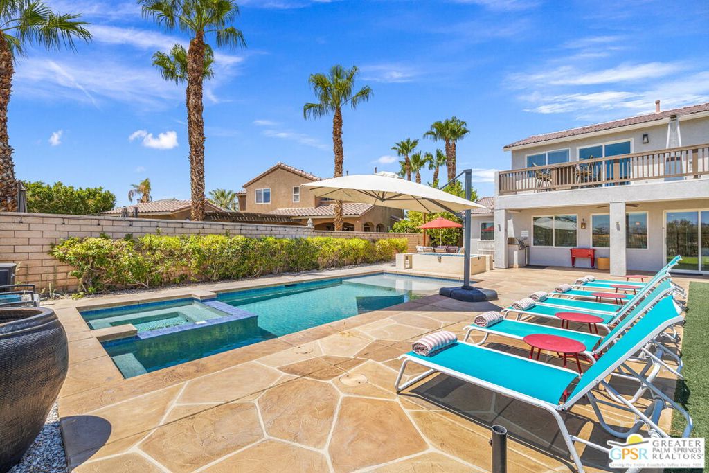Turnkey Furnished and Ready to Cash Flow atop the 9th Green at Terra Lago! This stunning pool home is fabulous SHORT-TERM RENTAL moneymaker. Perfectly positioned to capture panoramic mountain views, this entertainer's paradise is filled with resort-style amenities designed to impress. The saltwater pool and spa, 31-foot putting green, poolside fire pit, misting system, and color-changing pool lights create a five-star outdoor experience. A built-in Blaze grill and multiple lounge areas enhance the vacation atmosphere. Inside, the open-concept floor plan includes a spacious living room, an island-centered kitchen with stylish finishes, a dining area, and a game room that is perfect for hosting large groups. Two guest bedrooms are located on the main level, providing excellent separation and privacy. Upstairs, the Primary Suite features a large private deck with stunning views and a luxurious ensuite bath with soaking tub and separate shower. Two additional guest bedrooms share a full bath, and the second-floor laundry room adds everyday convenience. Low HOA dues include guard-gated security and access to a fitness center. The Golf Club at Terra Lago offers 36 scenic holes, and nearby Badlands Trail is perfect for hiking and outdoor adventure. Located just minutes to the Coachella and Stagecoach festivals as well! Take the Matterport Virtual Tour to experience the layout and flow of this exceptional property.