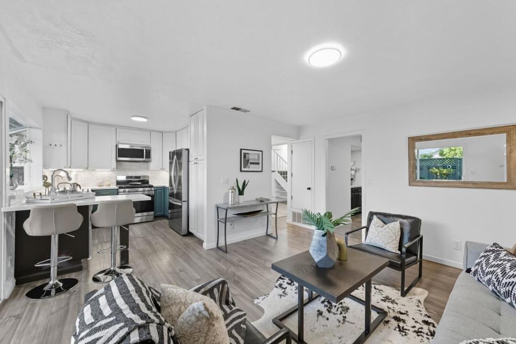 Winston Square is one of Foster City's most open and charming developments that is spaciously laid out with abundant trees and open spaces. This 4-bdrm/2.5-ba end unit home has a convenient floor plan with two patios that flow from the common areas to allow ample space for enjoyment. The main living/dining areas are open and spacious, with warm wood/vinyl plank floors, a convenient wet bar, and expansive sliding doors to both front & back patio. The kitchen is refreshed with newer countertop-backsplash, and extended modern peninsula and is bathed in natural light. Upstairs, the primary suite boasts a gorgeous walk-out balcony, a spacious en-suite with a walk-in shower, and a large walk-in closet. Three additional bedrooms, hallway skylights, and a separate laundry room offer comfort and convenience.. With its wonderful location (within a stone's throw of Beach Park Elementary School:-)), luminous interiors, and delightful entertaining spaces, this Foster City home inspires a lifestyle of casual California living at its best. Low HOA - only $275/month. Pools, kids playgrounds, and clubhouse.