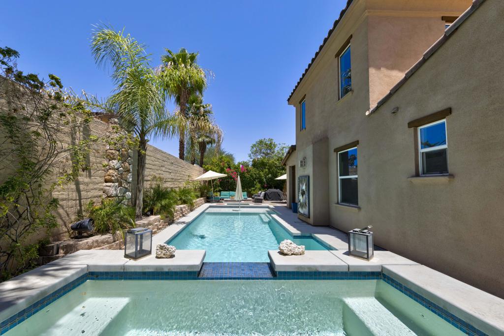 Tucked inside the gates of Village Traditions, this rare stand-alone home captures the Palm Springs lifestyle - modern, effortless, and unforgettable. Just a short stroll to all that downtown Palm Springs has to offer such as boutique shopping, acclaimed dining, and vibrant entertainment. It's the perfect blend of convenience and retreat. Perfectly positioned on an oversized corner lot, it offers privacy, panoramic mountain views, and a sparkling saltwater pool and spa. Inside, you'll find a thoughtfully designed 3BR/3BA layout with dual primary suites (one upstairs, one down), airy vaulted ceilings, and seamless indoor-outdoor flow. The upstairs loft provides flexible space for a gym, office, or cozy lounge. The kitchen is sleek and sophisticated with quartz counters and stainless appliances, while owned solar, a soft water system, and energy-efficient windows keep life comfortable and low-maintenance. Outside, enjoy smart pool controls, Sonos sound, and a private dog run. HOA covers internet, water, and trash. A two-car garage and guest parking complete this picture of contemporary Palm Springs living.