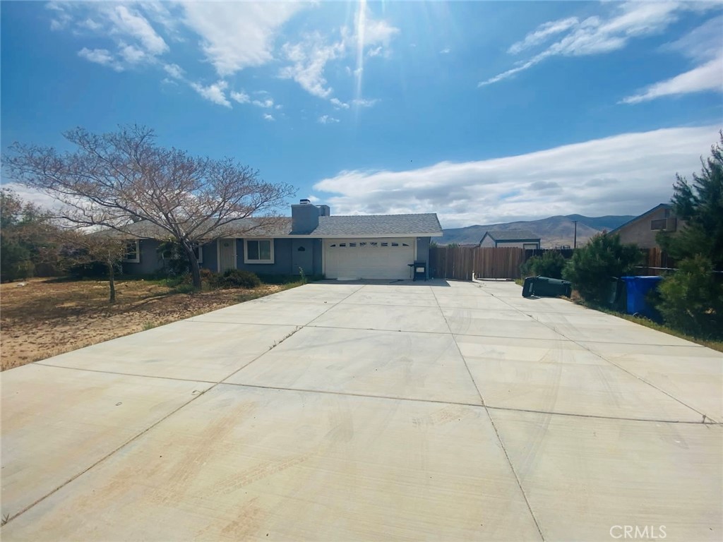 Don't miss this fantastic chance to own a piece of Apple Valley paradise! I'm thrilled to present 21259 Rosewood St, a gem in the desirable Circle Ranchos neighborhood. This property offers the perfect blend of comfort and potential. Whether you're a first-time homebuyer, looking to downsize, or seeking an investment opportunity, this home checks all the boxes. Located in a quiet, family-friendly neighborhood, you're still conveniently close to local amenities. The large lot size provides ample space for gardening, entertaining, or future expansions. This property represents excellent value in today's market. Offering a cozy gas fireplace with an elegant mantel - perfect for those chilly evenings! Recently updated kitchen with sleek countertops. RV parking and access to the huge backyard, perfect for all of your toys! Don't let this opportunity slip away.