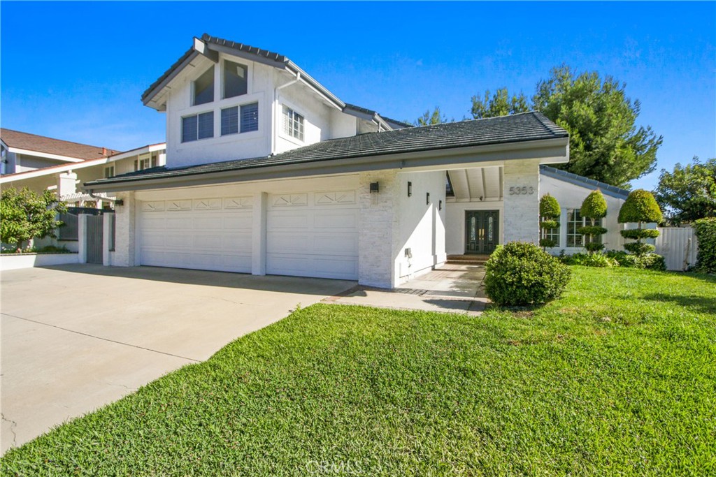 Nestled in the prestigious Westridge Community. This Artfully reimagined Estate embodies impeccable taste, exemplifies refined elegance featuring 4 BEDROOMS, 3 BATHROOMS, OFFICE, FAMILY ROOM, 3-Car Garage with built-in cabinetry, FIRST LEVEL BEBROOM AND FULL BATHROOM-IN LAWS with independent access, NO MELLO-ROOS & EXTREMLY LOW HOA; Upon entry, you’ll be greeted by an open-bright-airy layout, highlighted by soaring 2-Story ceilings and a stunning 15 foot, 6-panel sliding door that creates a seamless indoor-outdoor living experience—perfect for intimate gatherings and grand-scale entertaining. The Chef’s KITCHEN is a masterpiece, featuring quartzite counter tops and full-height backsplash, undermount sink, lazy Susan cabinetry, soft-close drawers and doors, sophisticated gold-accented fixtures and matching gold hardware, 5-burner wolf range top with range hood and built-in: Contemporary LG Refrigerator with commercial-edge design, dishwasher, Kenmore convention oven & microwave. DINNING ROOM with waterfall quartzite table that adds sophistication and style. On the main level, you will find a private OFFICE with elegant accent wall and a welcoming FAMILY ROOM with surround system, veneer accent wall, and a sleek wet bar, as well as a spacious BEDROOM AND Spa Inspired FULL BATHROOM ideal for visitors or IN-LAWS with independent access from side yard. || UPTAIRS || As you ascend the grand staircase leads to the luxurious MASTER SUITE with a Grand Dressing Room where sunlight beams through your primary suite, custom walk-in closet, REMODELED MASTER BATHROOM with dual sinks, TWO ADDITONAL BEDROOMS, ANOTHER ELEGANTLY REMODELED BATHROOM and a convenient LAUNDRY CLOSET. ADDITIONAL FEAURES include Crown molding, double entry door, recess lighting, window shutters, dual-pane window, modern light fixtures, frameless shower enclosures in all bathrooms, luxury vinyl plank flooring in warm, tanned distressed wood finish throughout. throughout. OUTDOOR space showcases elegant white veneer walls, a charming front patio with a breakfast niche, modern light fixtures and a generously sized entertainer’s backyard with built-in Integrated outdoor media niche. Located just minutes from the 91 & 55 freeways, commuting makes a breeze. The community offers resort-style amenities including a heated Olympic-size pool, lighted tennis and pickleball courts, and BBQ & Entertaining Area. This is Anaheim Hills living at its finest—don’t miss the opportunity to make it yours!