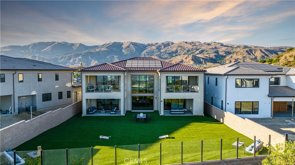(UNFURNISHED) Welcome to the luxurious guard-gated community of Westcliffe at Porter Ranch! Offering breathtaking city lights and mountain views, along with tennis courts and more, this community promises a serene and picturesque lifestyle.
20416 Albion Way boasts stunning scenic vistas from multiple vantage points, both inside and outside the home. As you enter, you'll be greeted by the highly coveted floating staircase, creating a grand and inviting ambiance. Recessed ceiling lights illuminate the home in the evenings, while ample natural light graces the interiors during the day.
The spacious living area features a modern linear fireplace, creating a cozy and inviting atmosphere that families adore. The chef's kitchen is a true masterpiece, featuring an exquisite marbled kitchen counter that beautifully complements the light-colored cabinetry.
This home offers the convenience of hard flooring throughout. Generously sized bedrooms and a spacious laundry room cater to the needs of a bustling household.
The master bedroom is a sanctuary in itself, with an opulent soaking tub, his and her sinks, a stunning standing shower, and a massive walk-in closet complete with its own balcony.
With plenty of flexible spaces, including a delightful loft, as well as a sizable yard and deck, this residence offers an abundance of opportunities for both relaxation and recreation. Don't miss the chance to experience the luxurious lifestyle that awaits in this remarkable home. Schedule your viewing today!