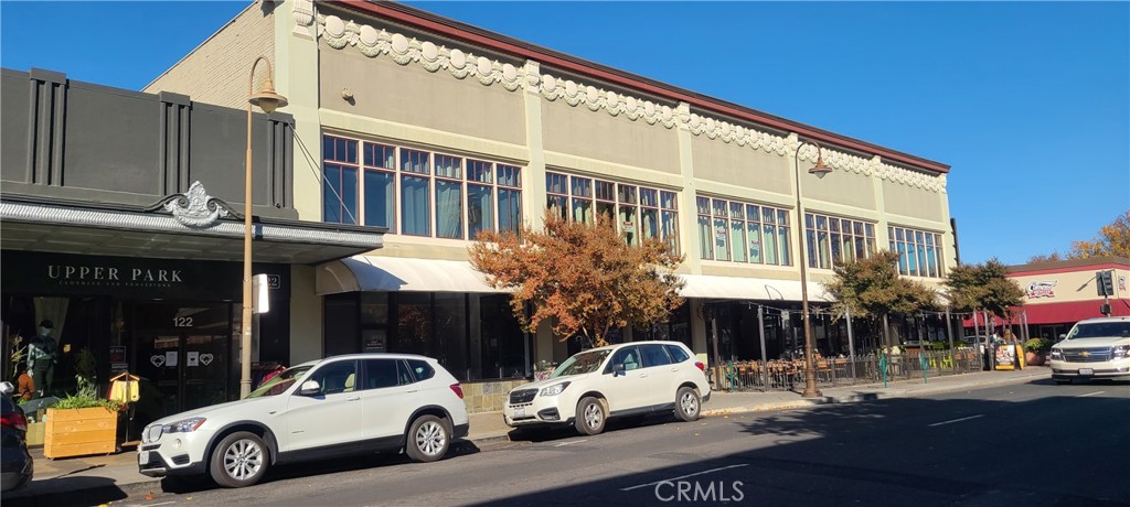 Professional office space in the Grandview Building, one of downtown Chico's most prominent buildings. Suite 260 includes large windows overlooking 3rd Street, tall ceilings, wood floors, and small kitchenette. Flexible floorplan includes front reception, large open bullpen area, and one large office. Upstairs suites are served by stairs and elevator. Adjacent tenants include Method Marketing, Liatrio, and Wilbur Ellis. NO ADDITIONAL CAM OR NNN FEES.