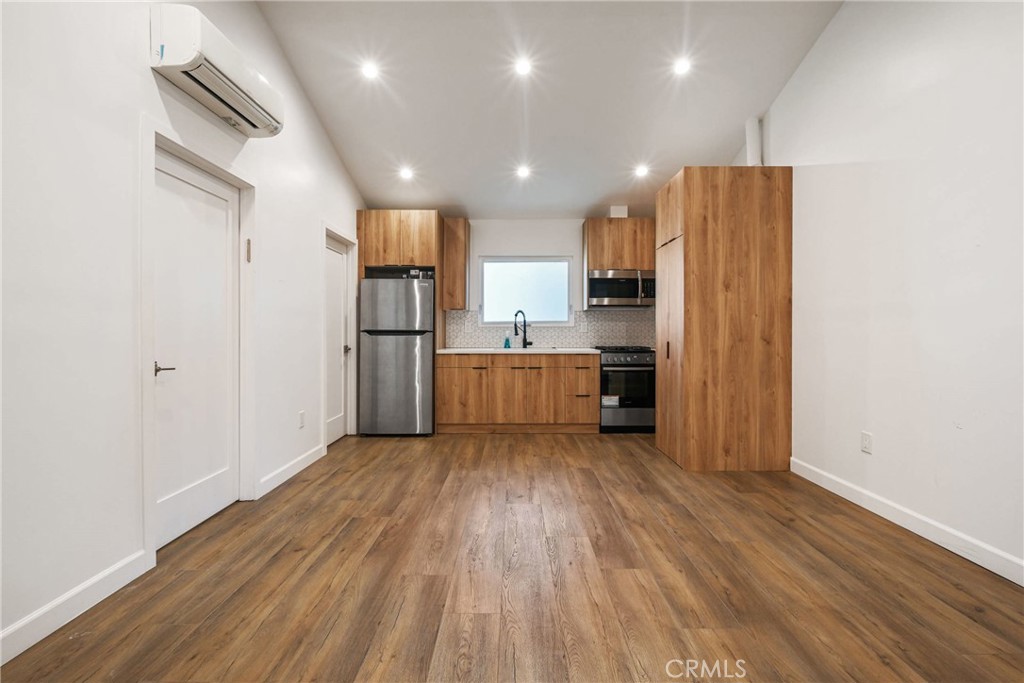 Newly built 1-bedroom, 1-bathroom ADU in West Hills. Features include an open floor plan, recessed lighting, modern finishes, and a kitchen with quartz countertops and stainless steel appliances. The bedroom offers closet space, and the bathroom includes contemporary fixtures. Private entrance and in-unit laundry hookups.