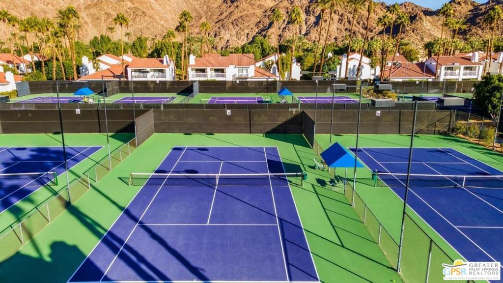 Experience Luxury and Convenience at This Tennis Villa in La Quinta Resort! Rare opportunity to own a stunning tennis villa in the prime location of the world-renowned, historic La Quinta Resort. Nestled next to the tennis courts, fitness center, and swimming pool/spa, this beautiful model is one of only TWO communities in La Quinta offering SHORT TERM RENTALS (STVR) a golden opportunity for investment buyers and perfect for a 1031 exchange. Whether you're looking for a part-time getaway or aiming to maximize your rental income with events like the BNP Paribas Open, Coachella, Stagecoach, and various local art shows, this villa is the ideal choice. Enjoy the on-site public golf course, fitness center and tennis facilities. The villa's main living areas are upstairs, featuring stunning wood flooring and travertine throughout. The oversized balcony next to the kitchen offers breathtaking views of the majestic mountains and gorgeous sunsets, perfect for entertaining with natural gas for cooking. Additional balconies off the dining room and living room overlook the tennis courts and fitness center. Convenience is at your fingertips with a laundry room in the lower closets and a 2-car garage with storage. A short stroll from your villa brings you to the resort's numerous onsite restaurants, and Old Town La Quinta is just a walk, bike ride, or short drive away, offering more dining and shopping options. This villa has been a highly successful short-term rental through the hotel, professionally decorated, and sold turnkey furnished. Don't miss out on this exceptional opportunity to own a piece of paradise in La Quinta Resort!