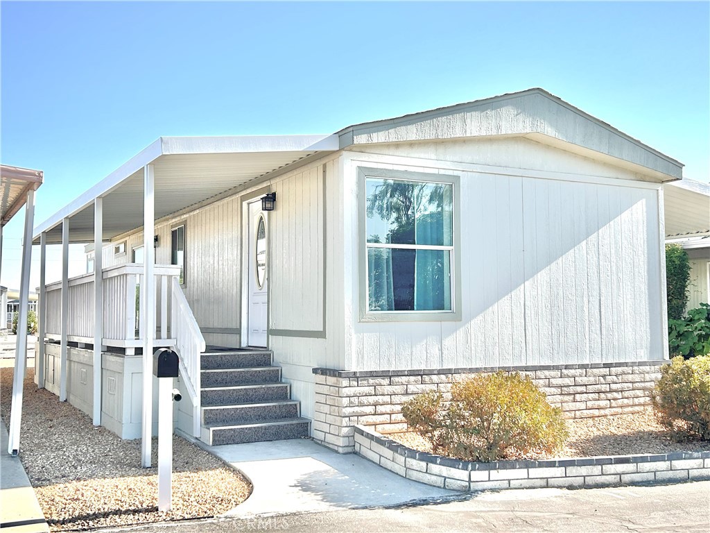 Welcome to this light-filled, beautifully updated manufactured home located in a peaceful 55+ community. Offering modern comfort and a low-maintenance lifestyle, this home is designed for easy living and enjoyment.
Step inside to an open concept living space with fresh flooring, and large windows that fill the home with natural light. The kitchen offers ample cabinetry, a breakfast bar, and plenty of counter space perfect for entertaining or everyday meals.
Features include:
? 2 spacious bedrooms with generous closet space and newer carpet
? Bright open layout with ceiling fans and updated finishes throughout
? Covered front porch & carport for shade and convenience
? Low-maintenance landscaping for easy care
? Quiet location in a well-kept community close to shopping, dining, and services
Enjoy the tranquility and connection that this active 55+ neighborhood offers while living in a home that is move-in ready and waiting for you.